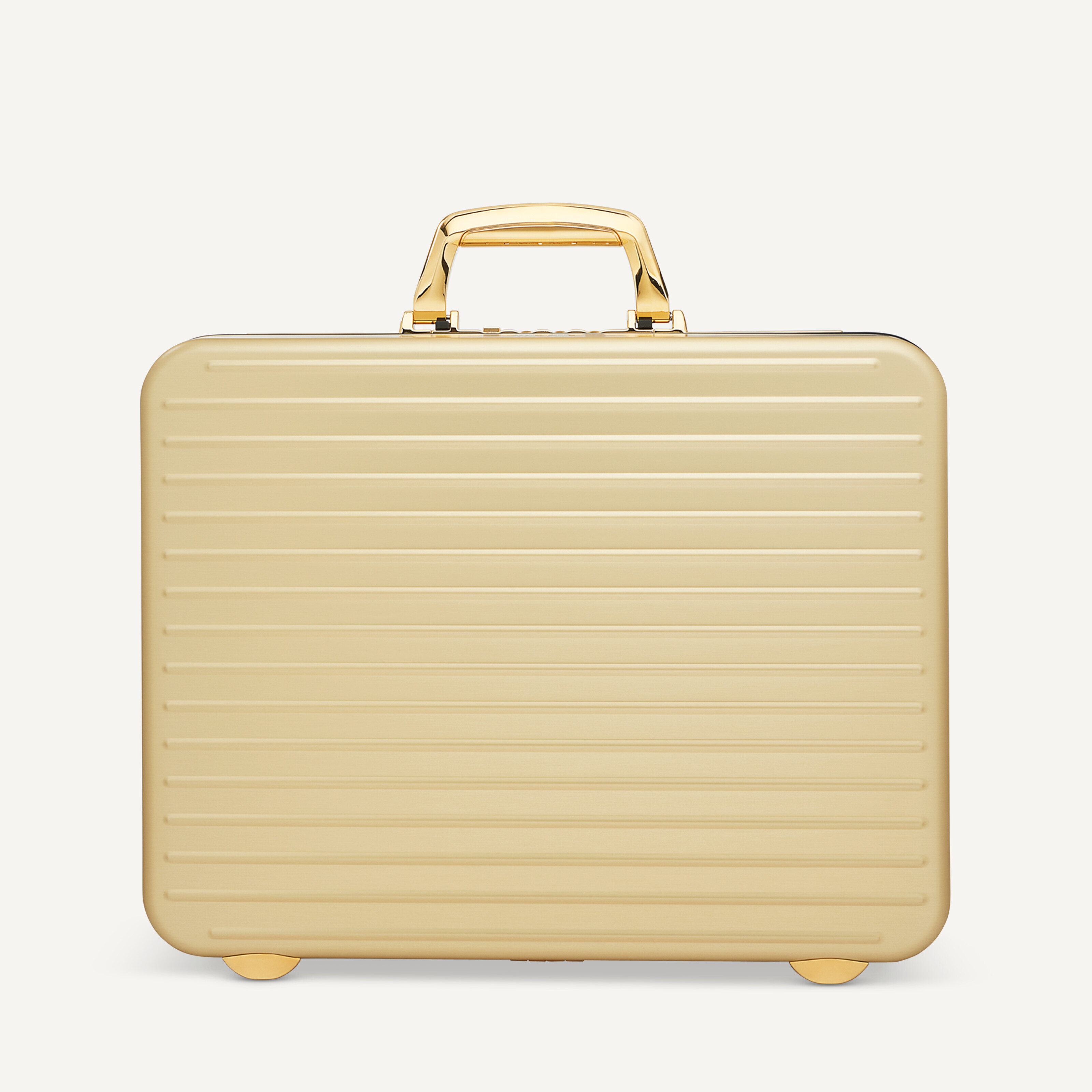 A LIMITED EDITION GOLD ALUMINIUM ATTACHÉ BRIEFCASE WITH GOLD
