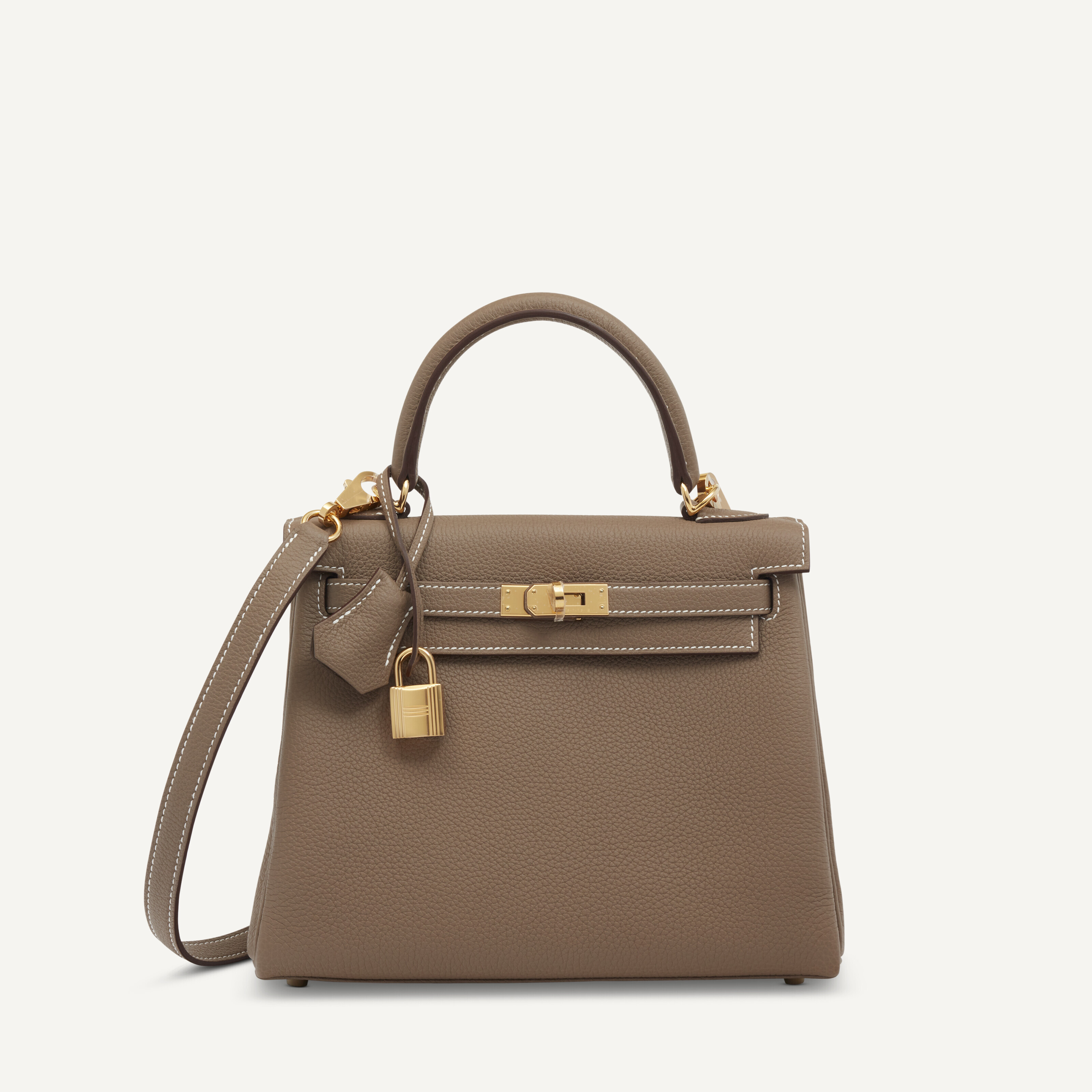 AN ÉTOUPE TOGO LEATHER RETOURNÉ KELLY 25 WITH GOLD HARDWARE