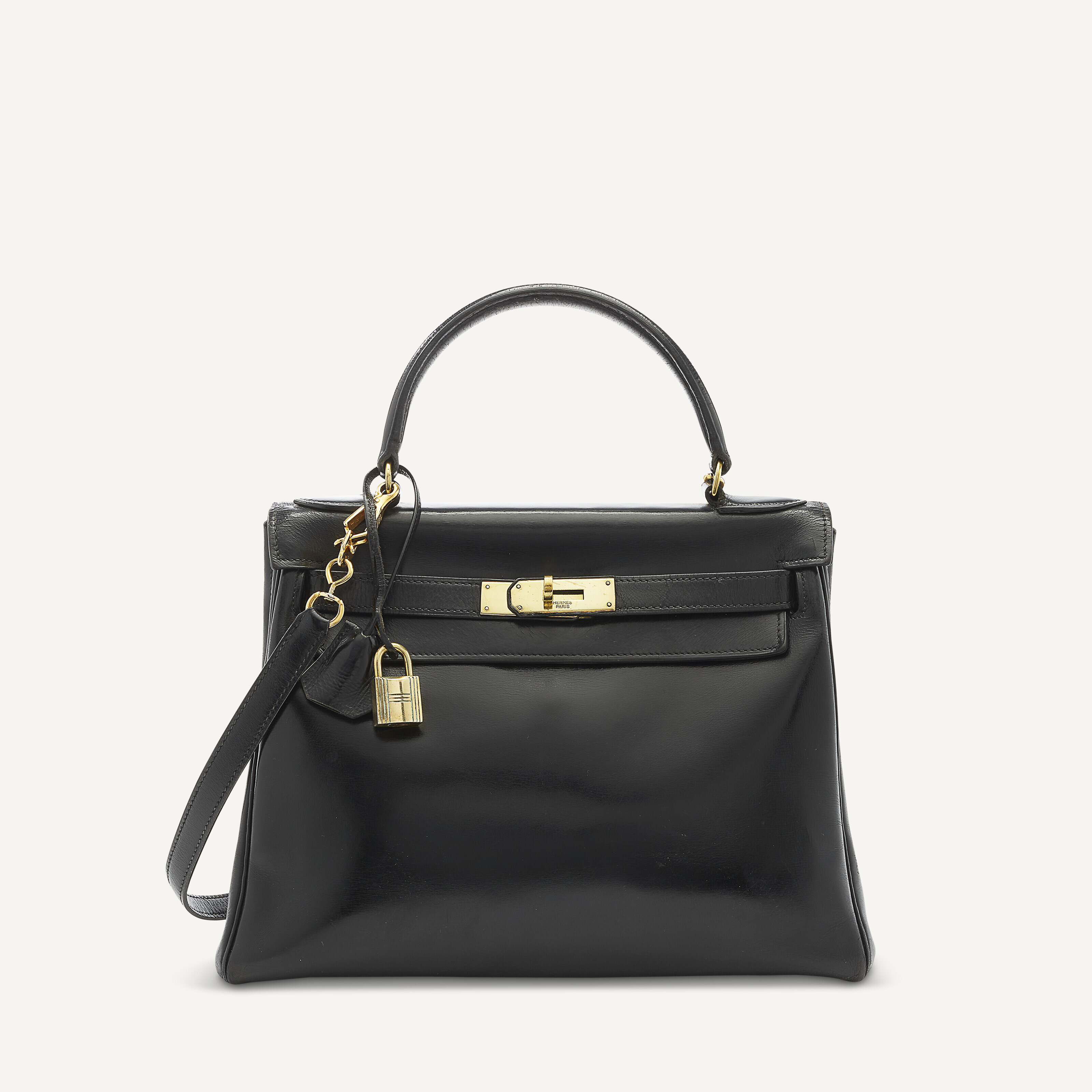 A BLACK CALF BOX LEATHER RETOURN KELLY 28 WITH GOLD HARDWARE