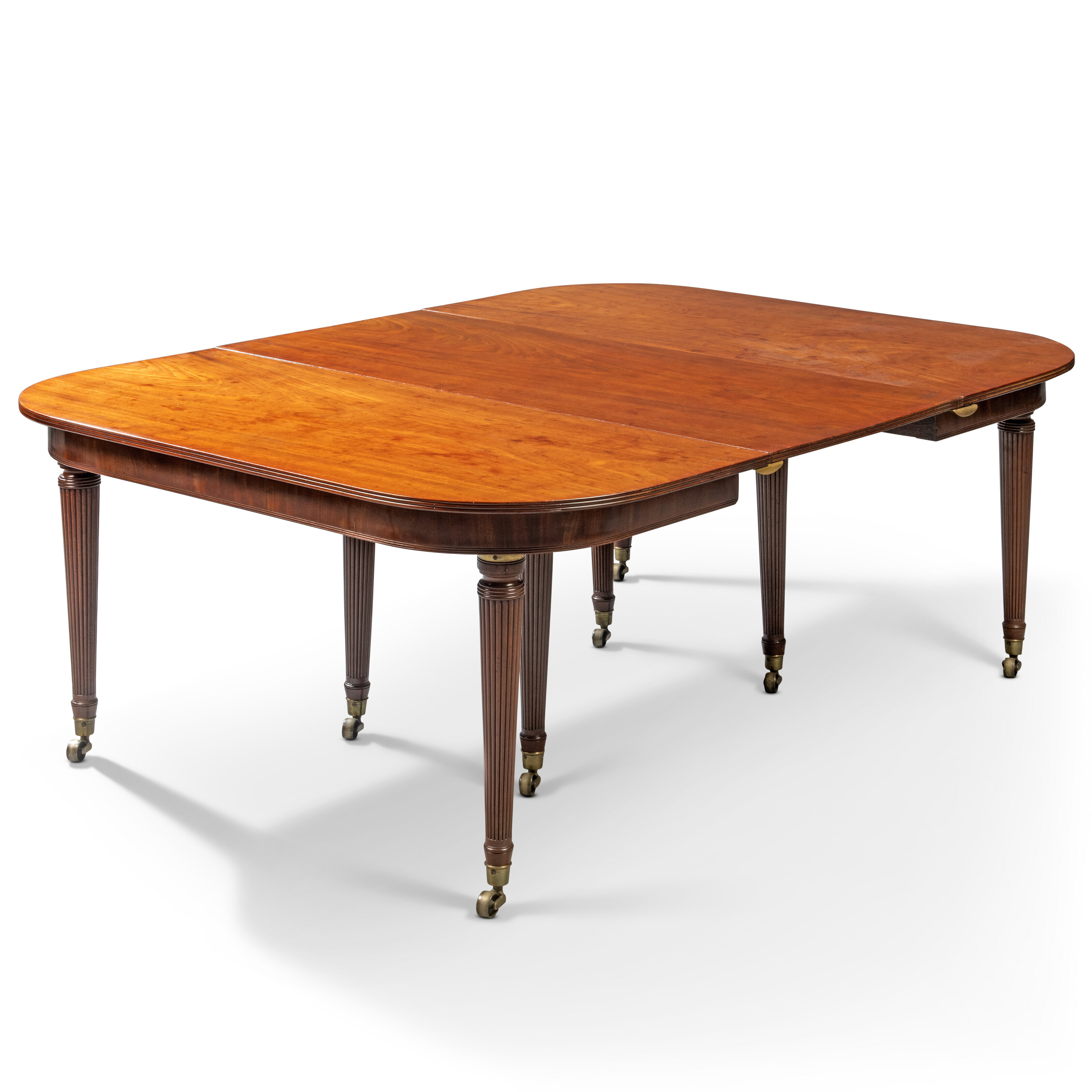 A REGENCY MAHOGANY 'IMPERIAL' EXTENDING DINING-TABLE