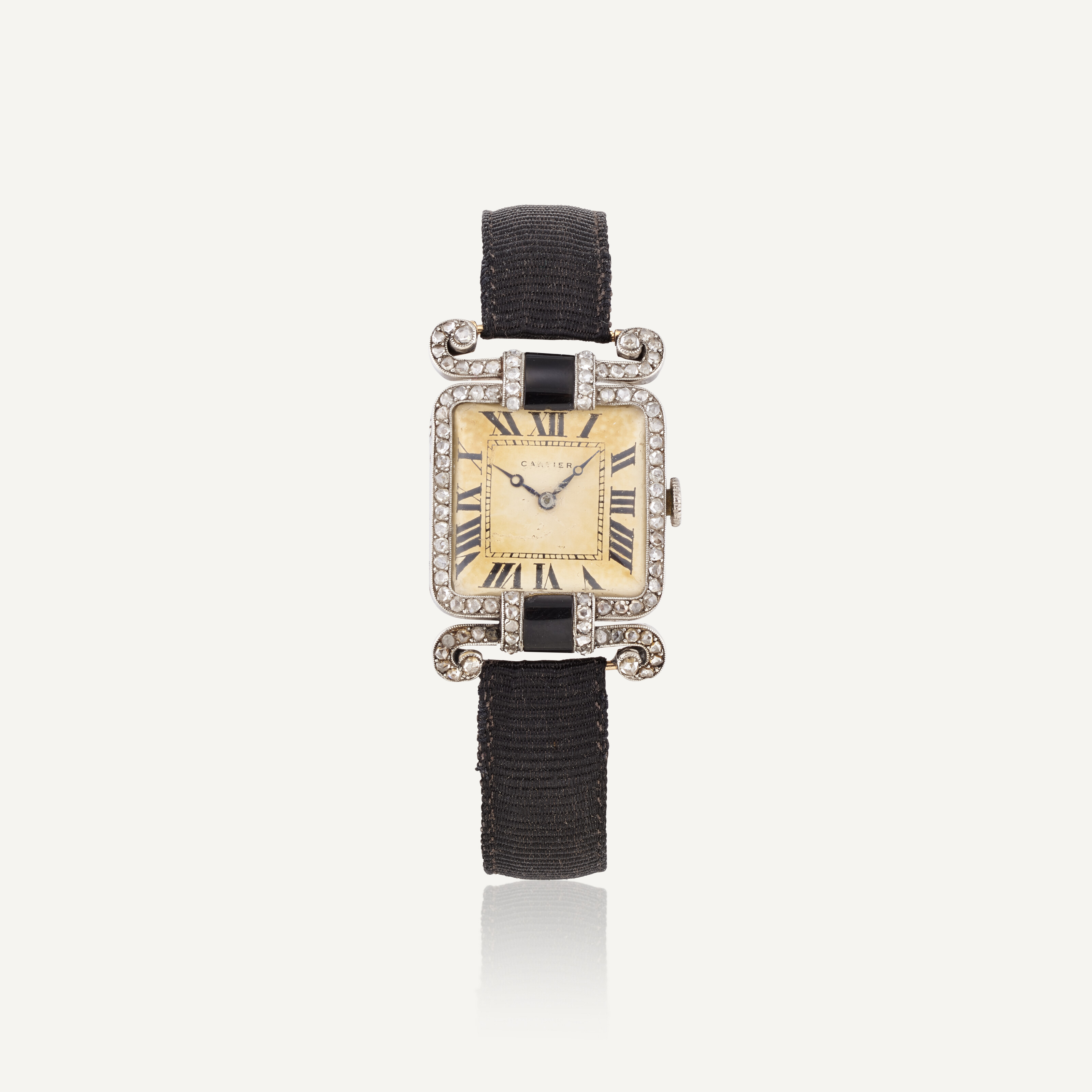 Catalog image of CARTIER LADY'S EARLY 20TH CENTURY DIAMOND AND ONYX WRISTWATCH