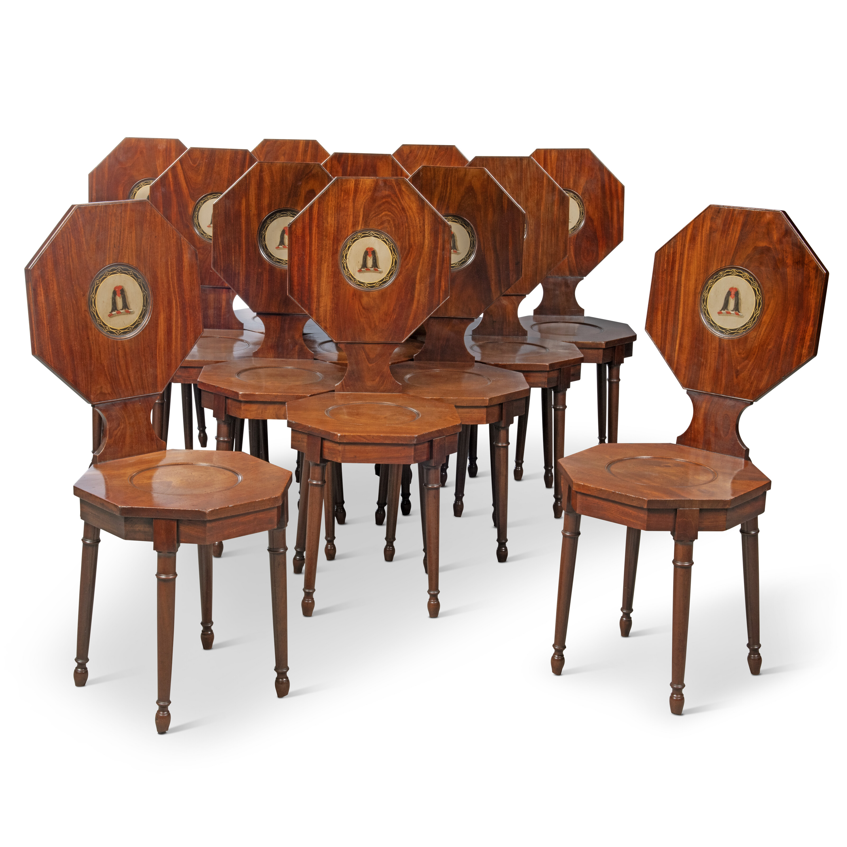 A SET OF TWELVE GEORGE III HALL CHAIRS, ATTRIBUTED TO GILLOWS