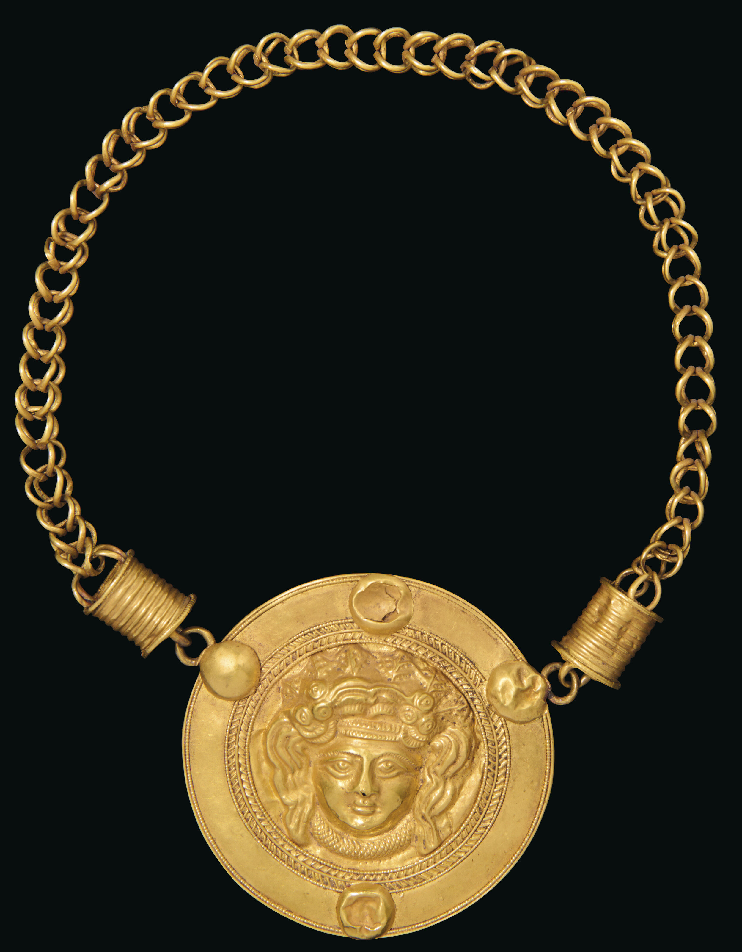 An Egyptian gold necklace with medallion of Medusa, Roman period, circa 3rd century AD, offered in Works of Art from the Mougins Museum of Classical Art, Online from 26 November to 10 December 2024 at Christie's Online