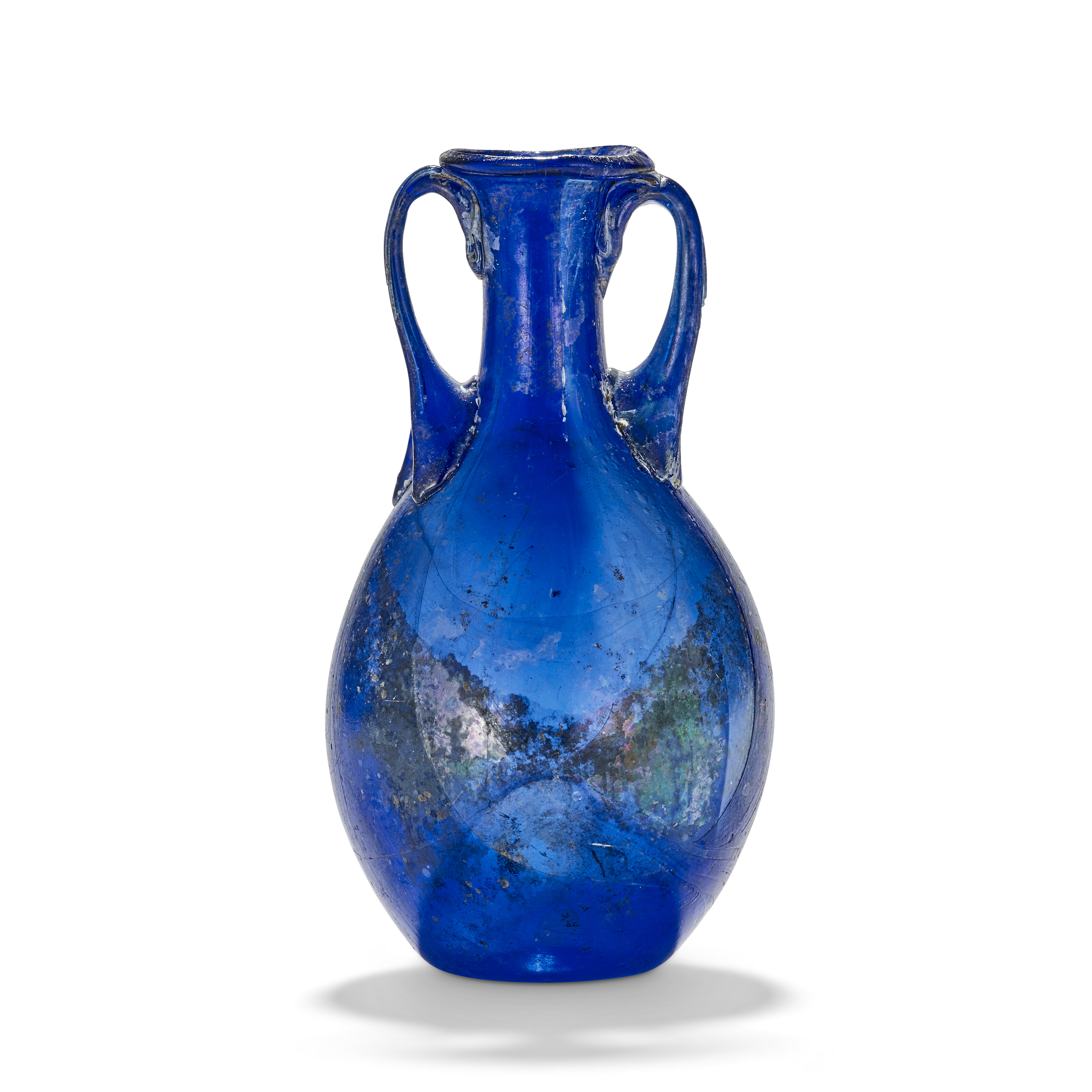 A Roman blue glass amphoriskos, circa 1st century AD, offered in Works of Art from the Mougins Museum of Classical Art, Online from 26 November to 10 December 2024 at Christie's Online