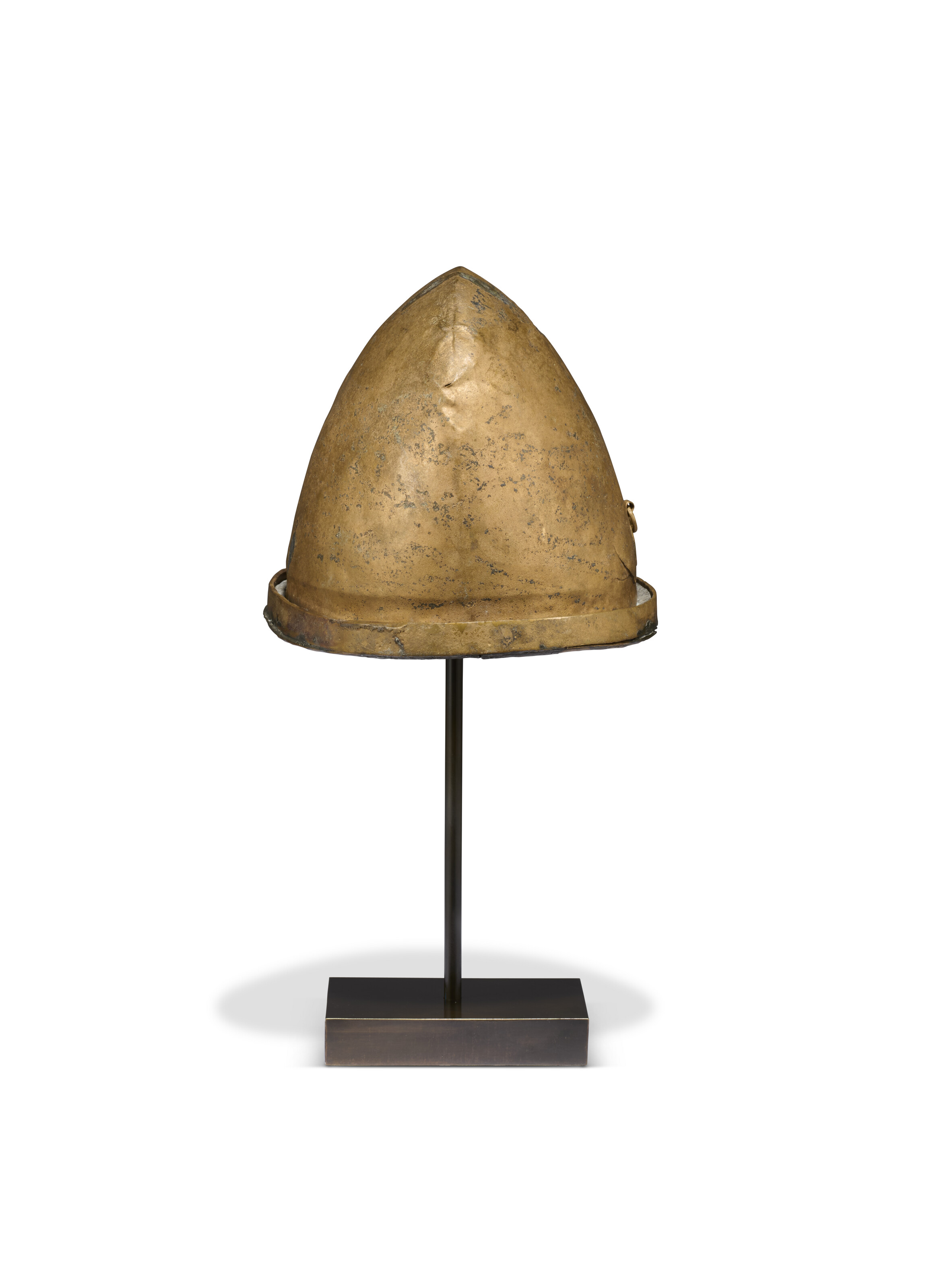 AN ETRUSCAN BRONZE HELMET OF NEGAU TYPE, CIRCA 5TH CENTURY B.C.