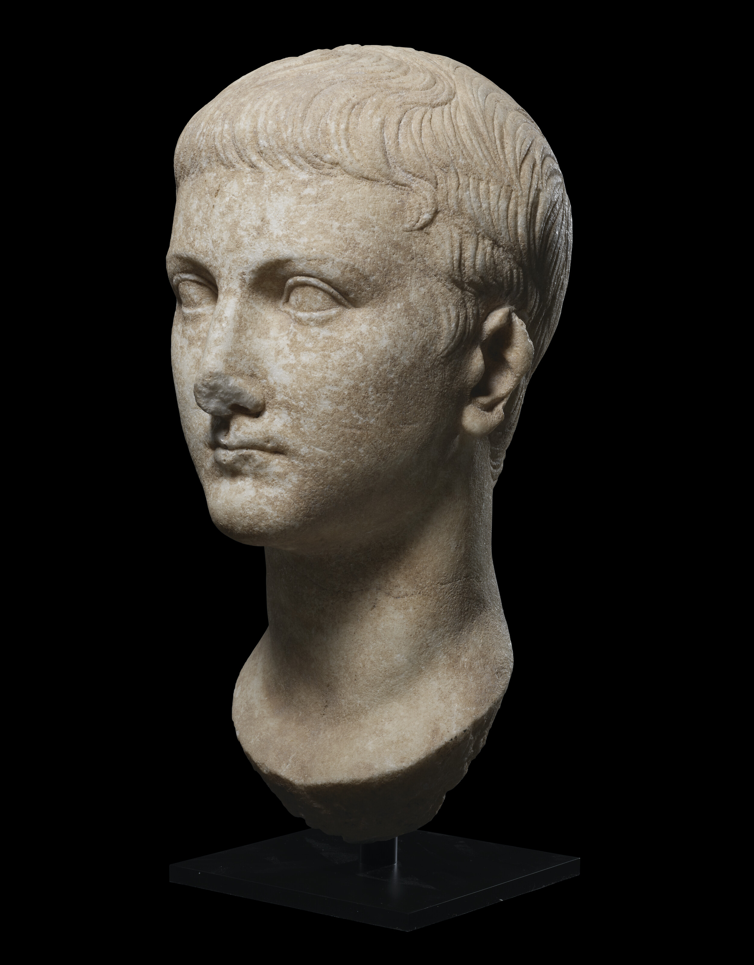 A Roman marble portrait head of a youth, Julio-Claudian, circa early 1st century AD, offered in Antiquities from The Mougins Museum of Classical Art on 4 December 2024 at Christie's in London
