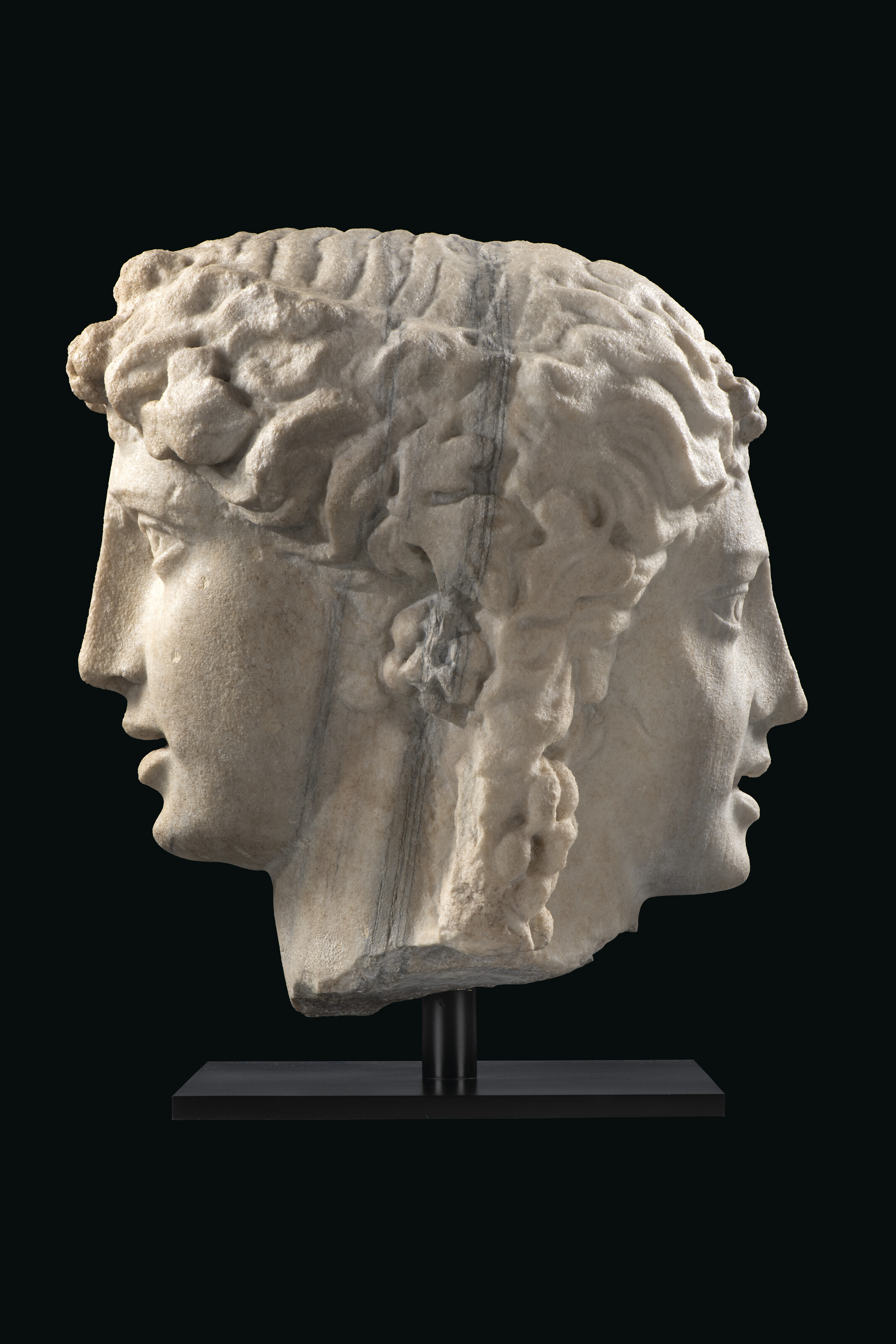 A monumental Roman marble janiform herm of Bacchus and Ariadne, circa 2nd-3rd century AD, offered in Antiquities from The Mougins Museum of Classical Art on 4 December 2024 at Christie's in London
