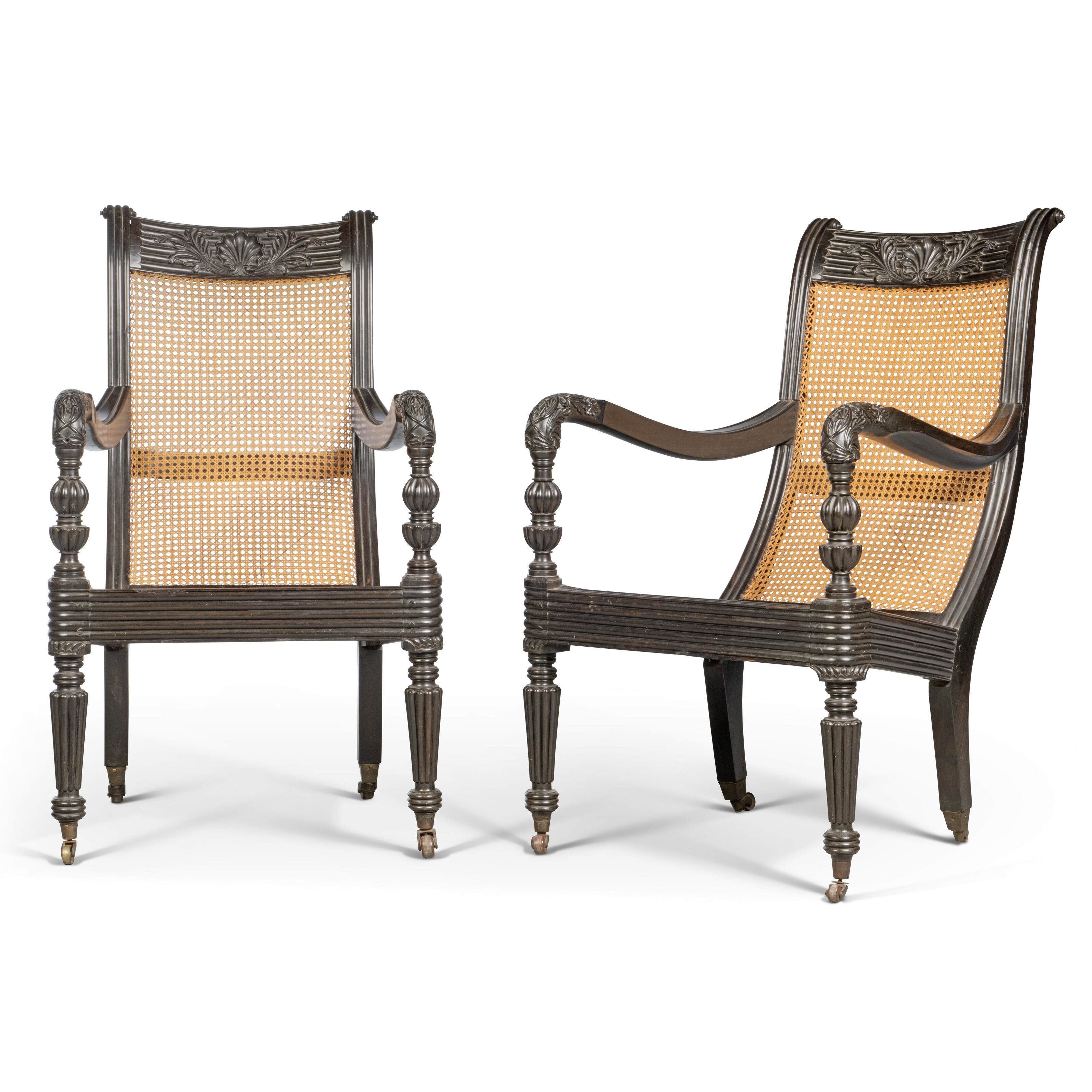 A pair of Anglo-Indian ebony and caned armchairs, mid-19th century, sold for £8,190 on 23 May 2024 at Christie's in London