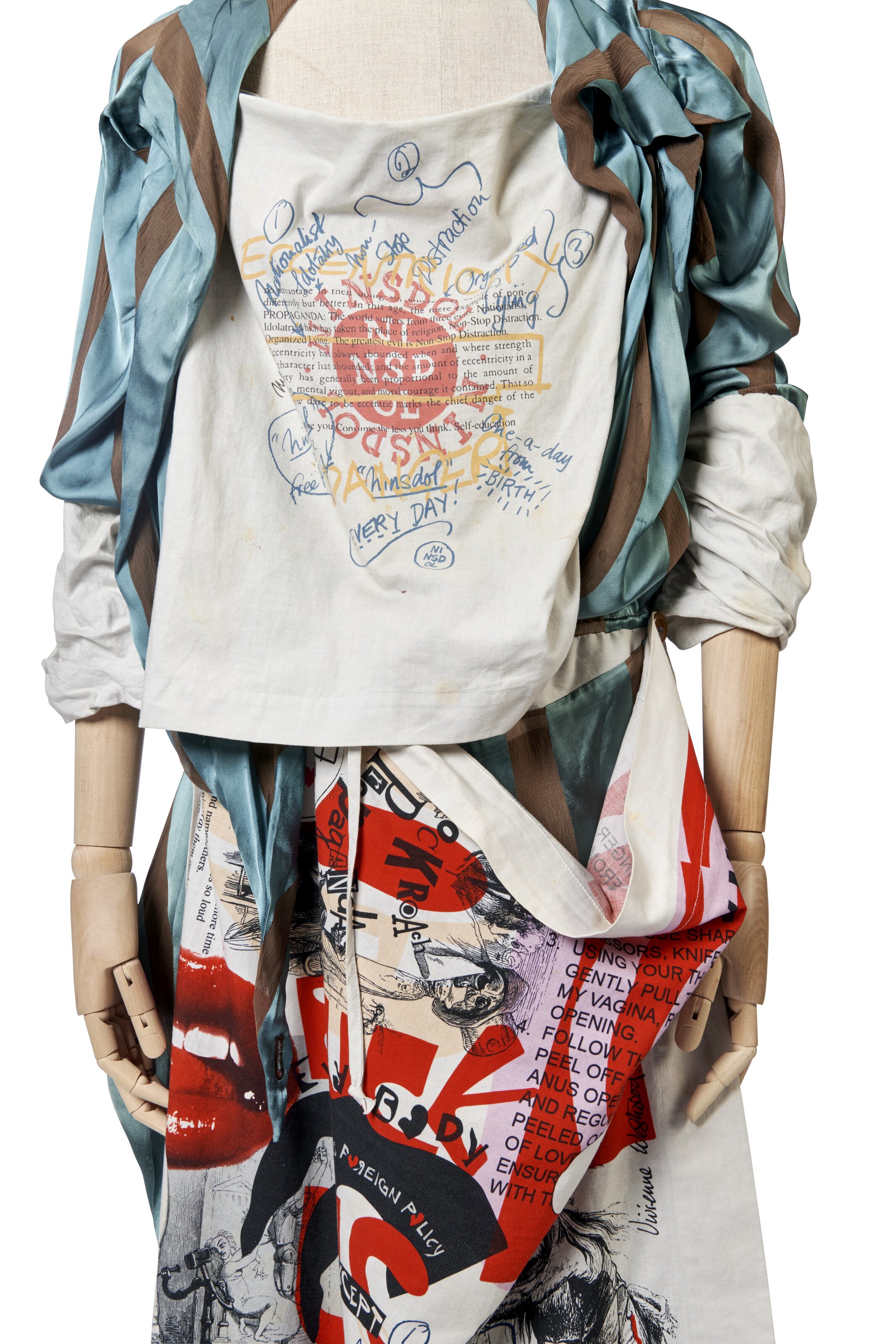 Vivienne Westwood, a cotton dress with printed ‘Propaganda’ modesty panel and apron with blue and white striped blouse, from the Propaganda Collection, Spring-Summer 2005/06, offered in Vivienne Westwood: The Personal Collection - Part I on 25 June 2024 at Christie's in London