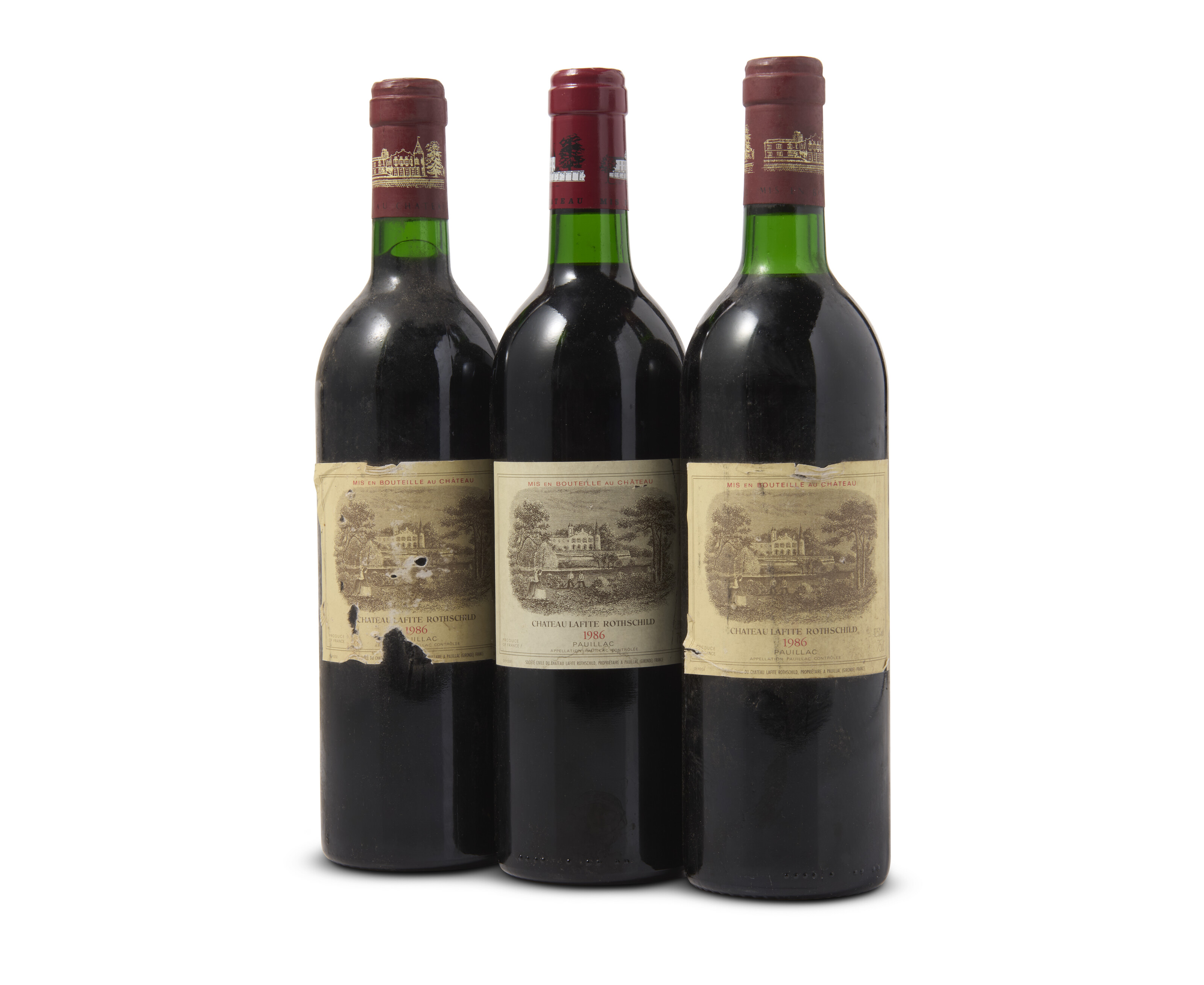 Château Lafite Rothschild 1986, Two capsule styles. Two scuffed and ...