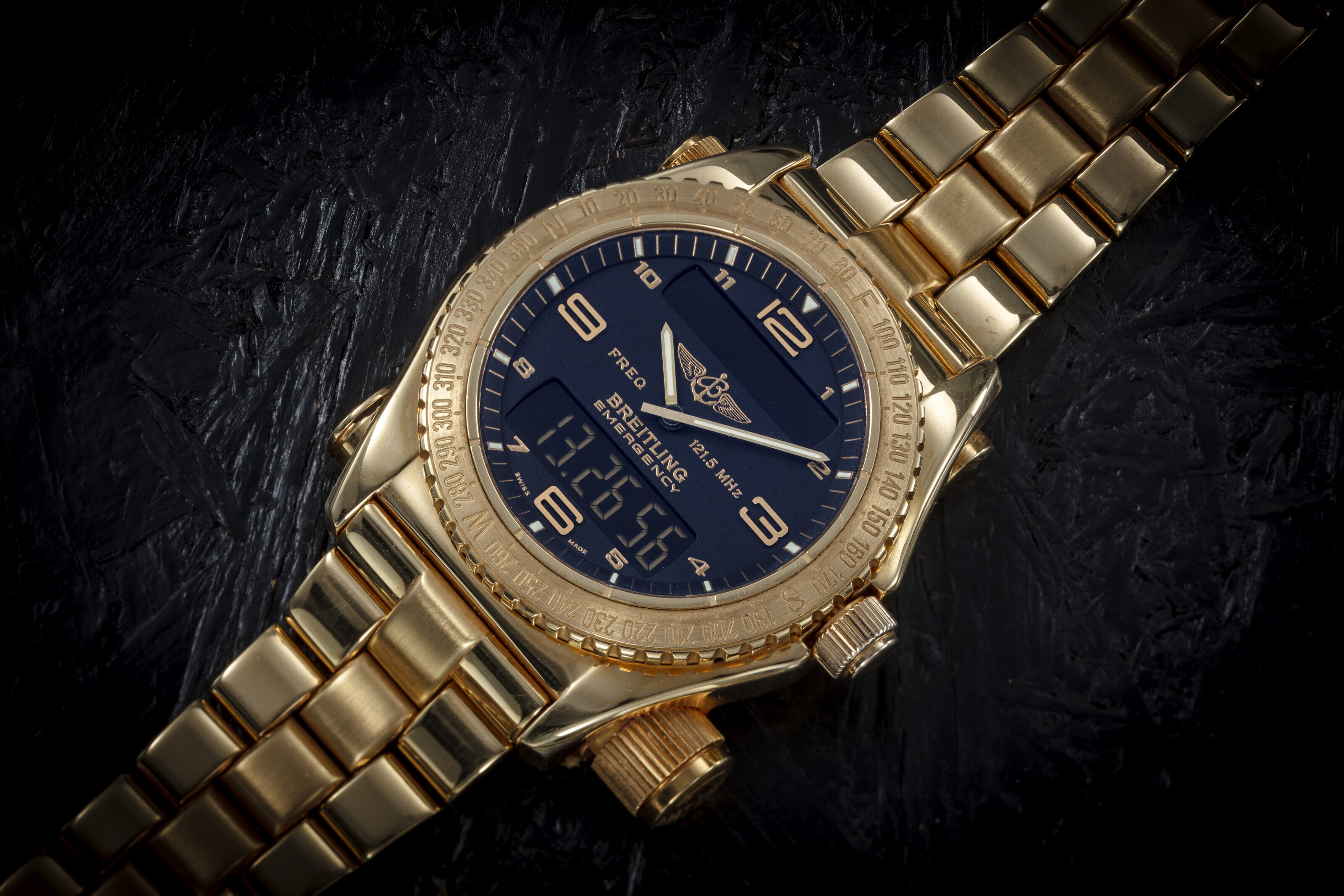 BREITLING, EMERGENCY, A LIMITED EDITION GOLD WRISTWATCH WITH