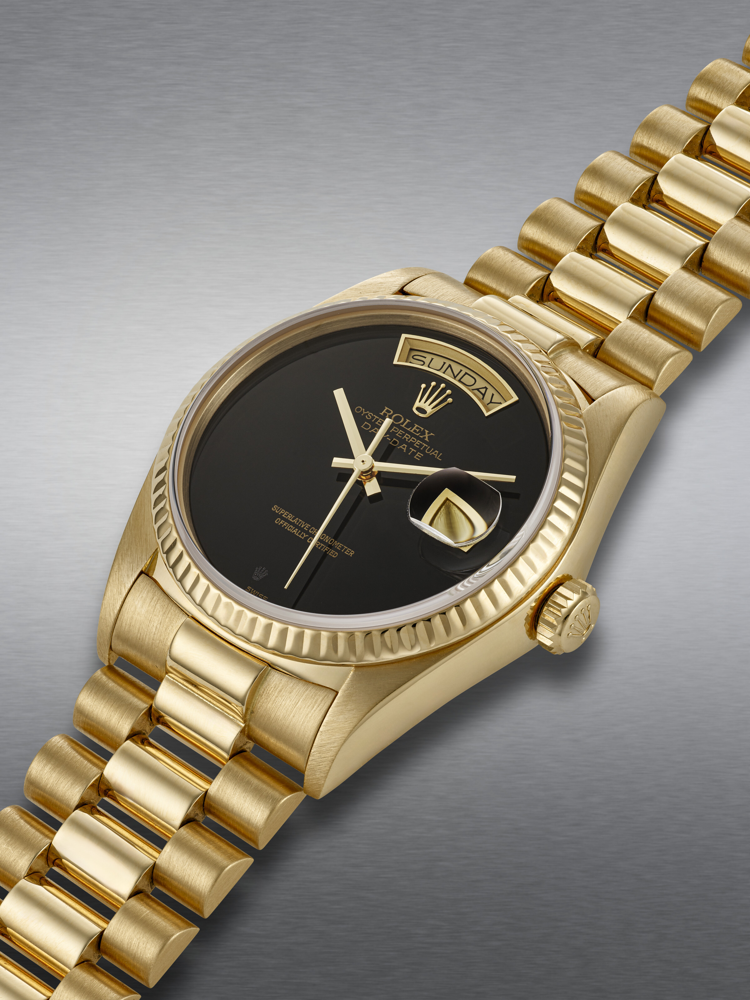 ROLEX, YELLOW GOLD 'DAY-DATE', WITH ONYX DIAL, REF. 18168
