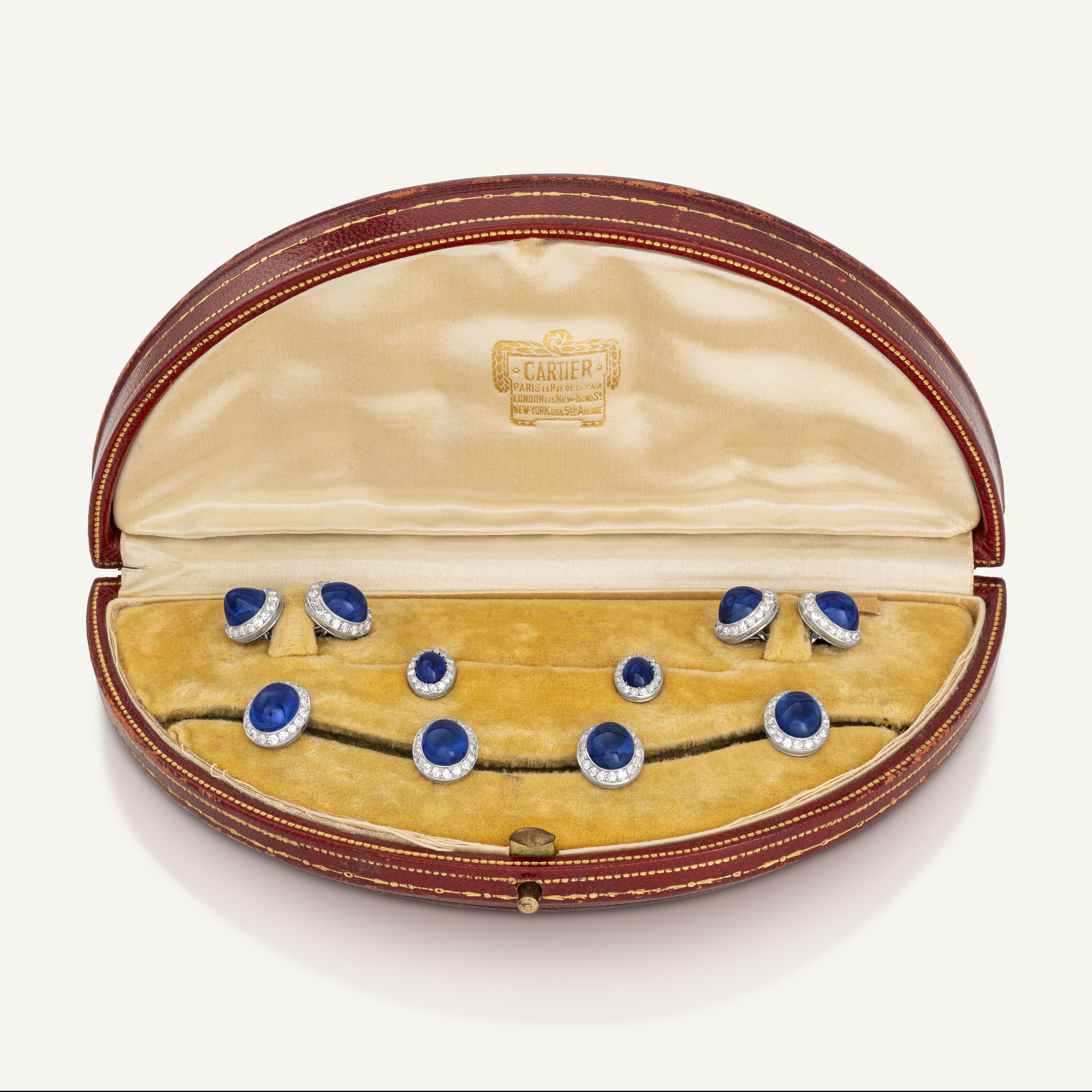A Cartier Art Deco sapphire and diamond dress set, circa 1925, offered in Jewels Online: The Geneva Edit on 8-22 May 2024 at Christie's Online