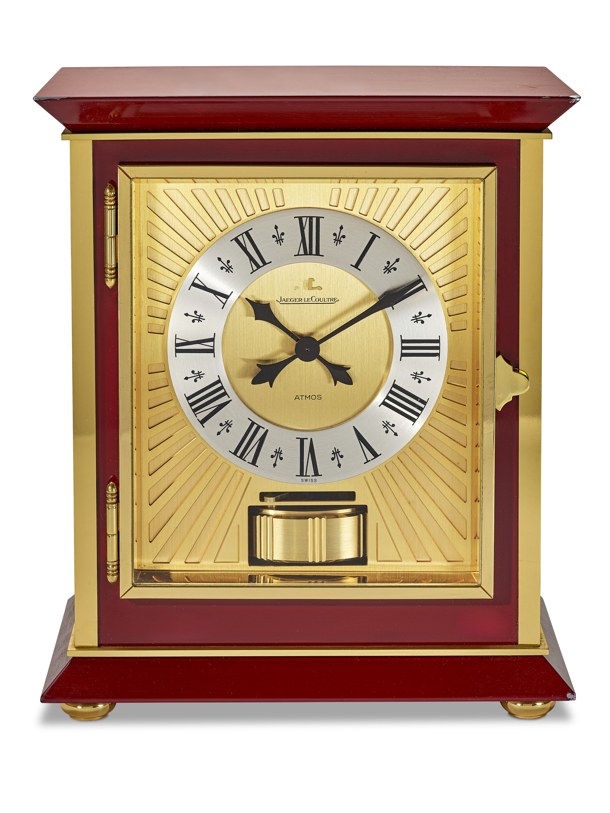 JAEGER-LECOULTRE, GILT BRASS AND RED LACQUER 'ATMOS ROYALE