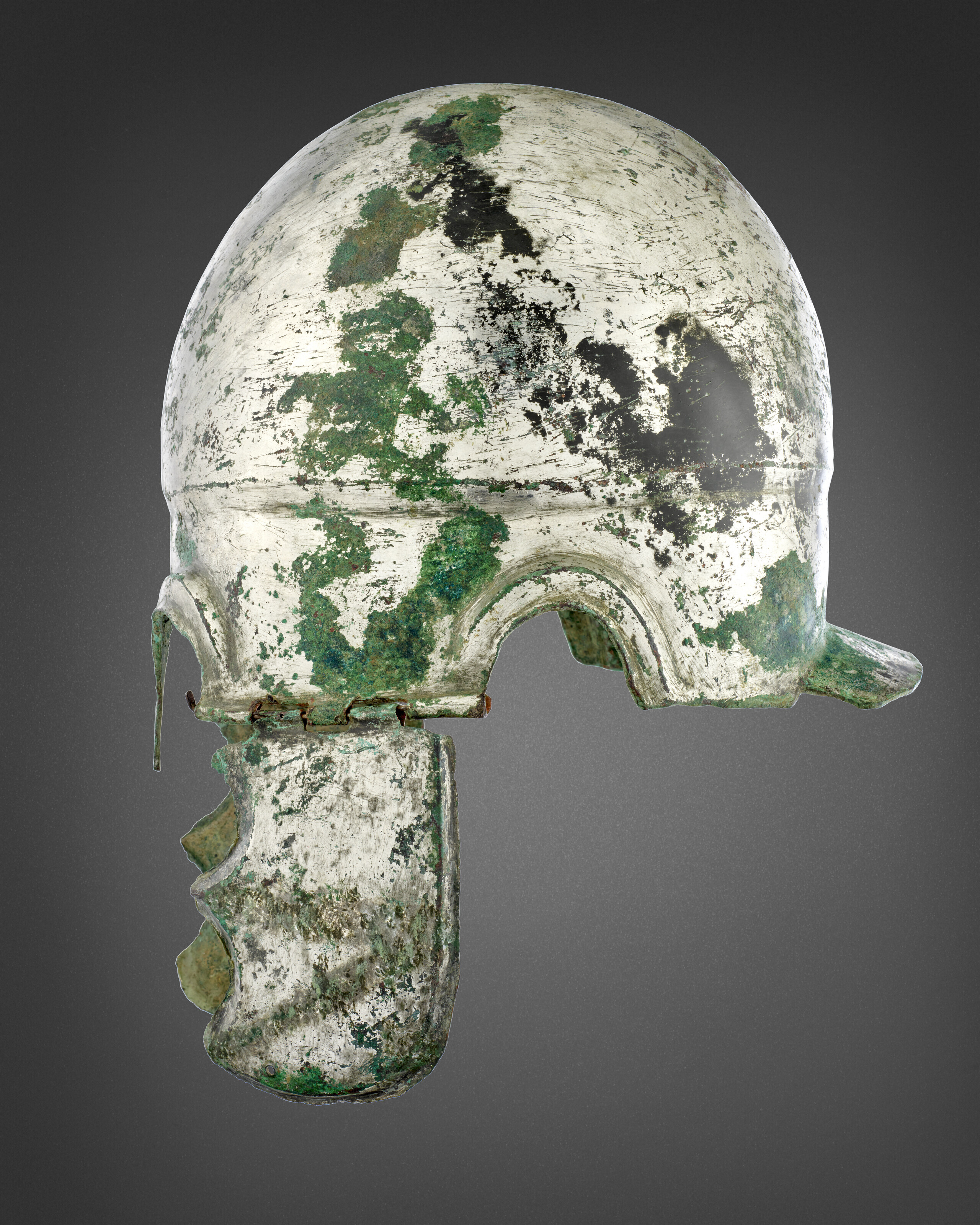 A GREEK TINNED BRONZE CHALCIDIAN HELMET, LATE CLASSICAL TO