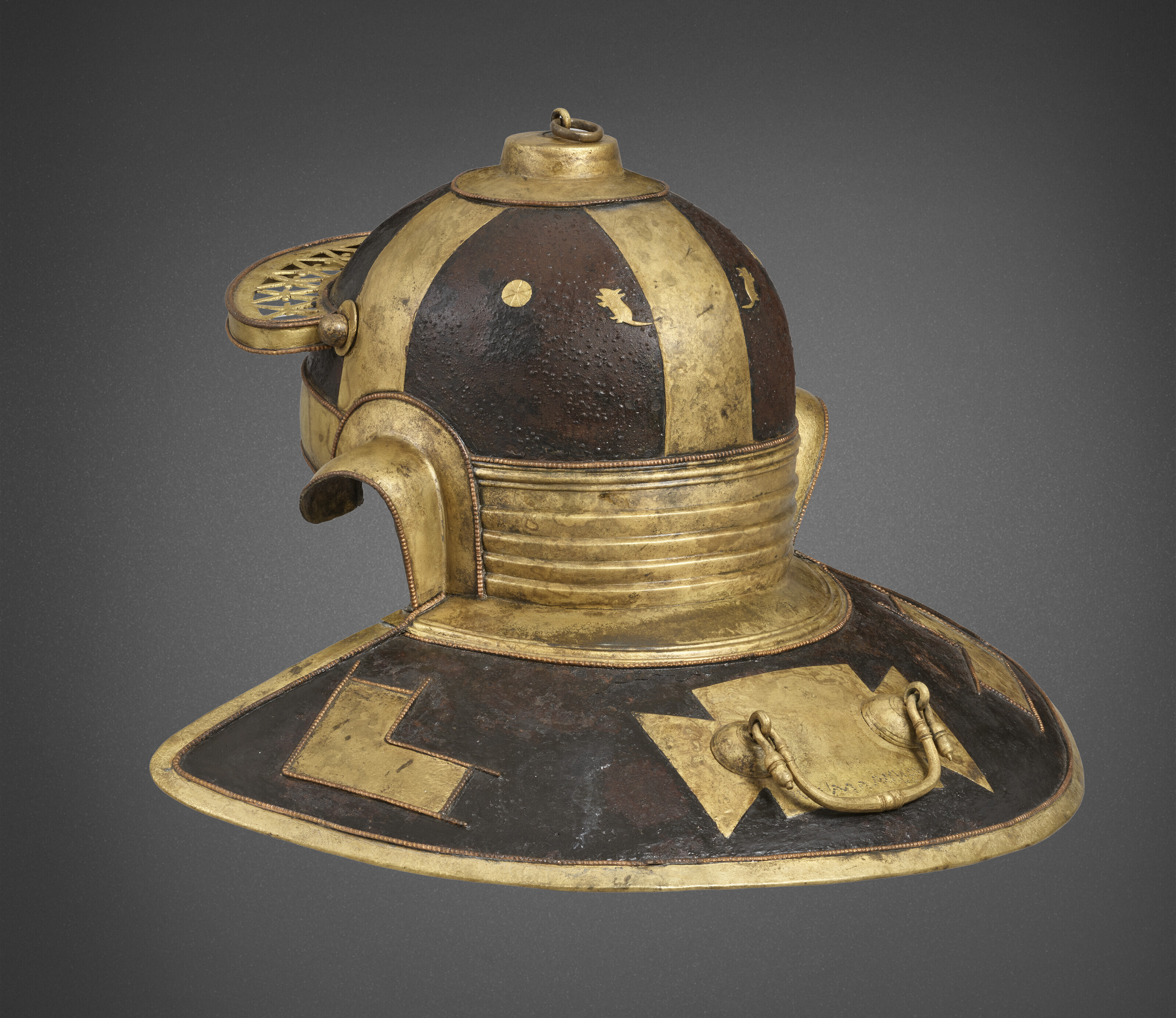 The Guttmann Mouse Helmet: an important Roman iron, brass and copper helmet for Julius Mansuetus, together with a dolabra, Antonine period, circa 125-175 A.D., offered in Arms and Armour from the Mougins Museum of Classical Art, Part I on 30 January 2024 at Christie's in New York