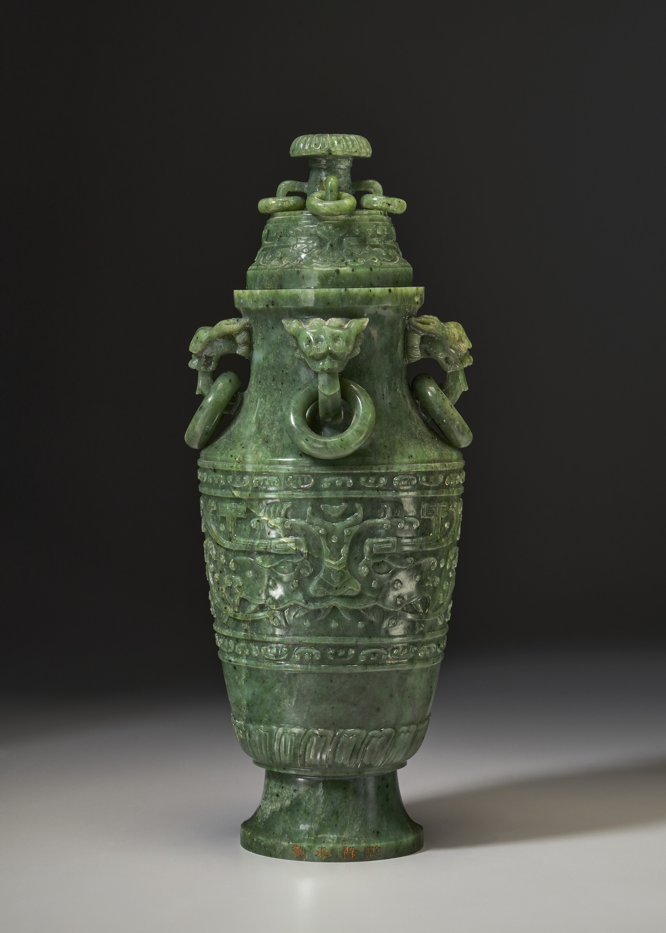 AN ARCHAISTIC SPINACH-GREEN JADE VASE AND A COVER, 19TH CENTURY