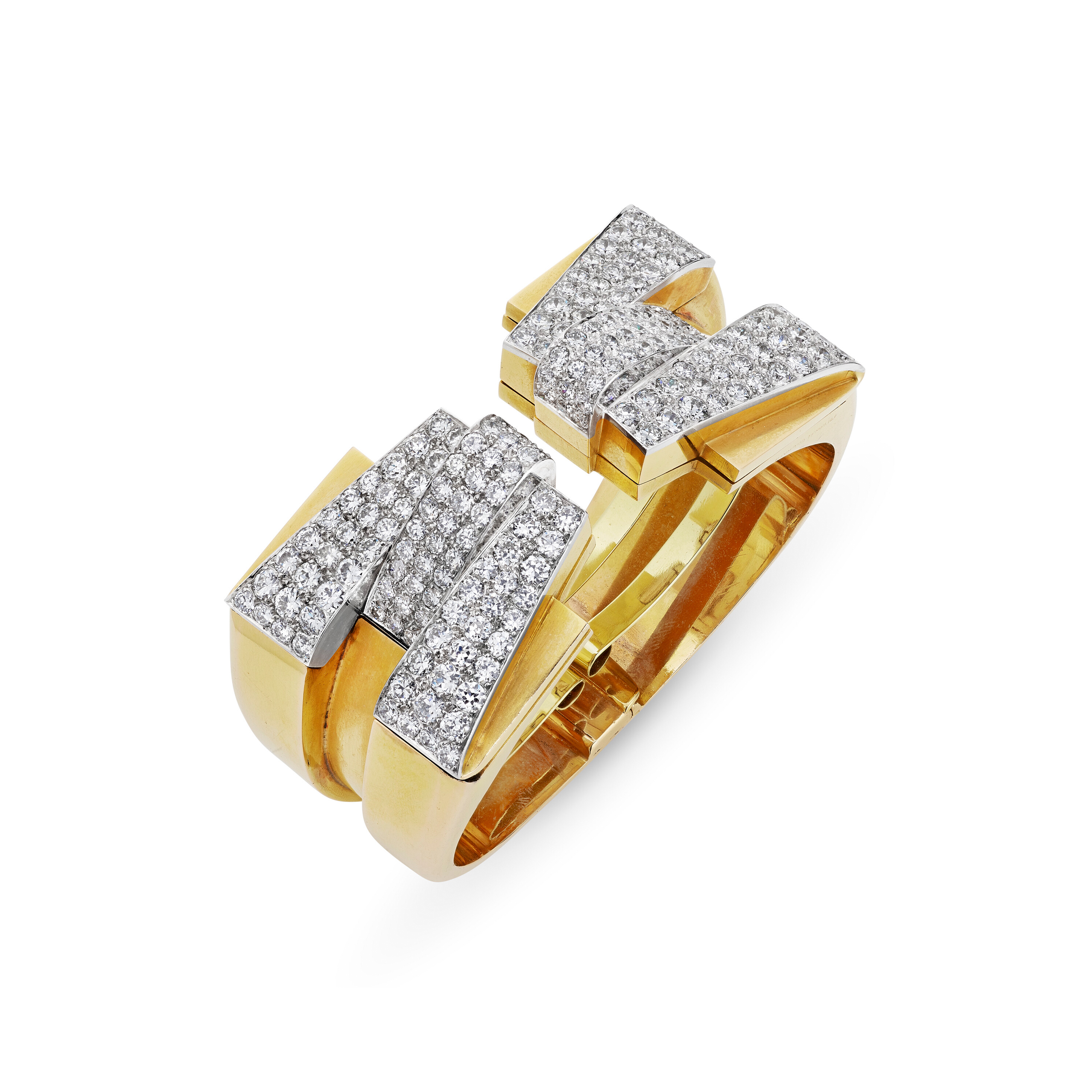 Raymond Templier. Art Moderne clip-brooches with a combination cuff bracelet. Sold for $151,200 on 10 December 2024 at Christie's in New York