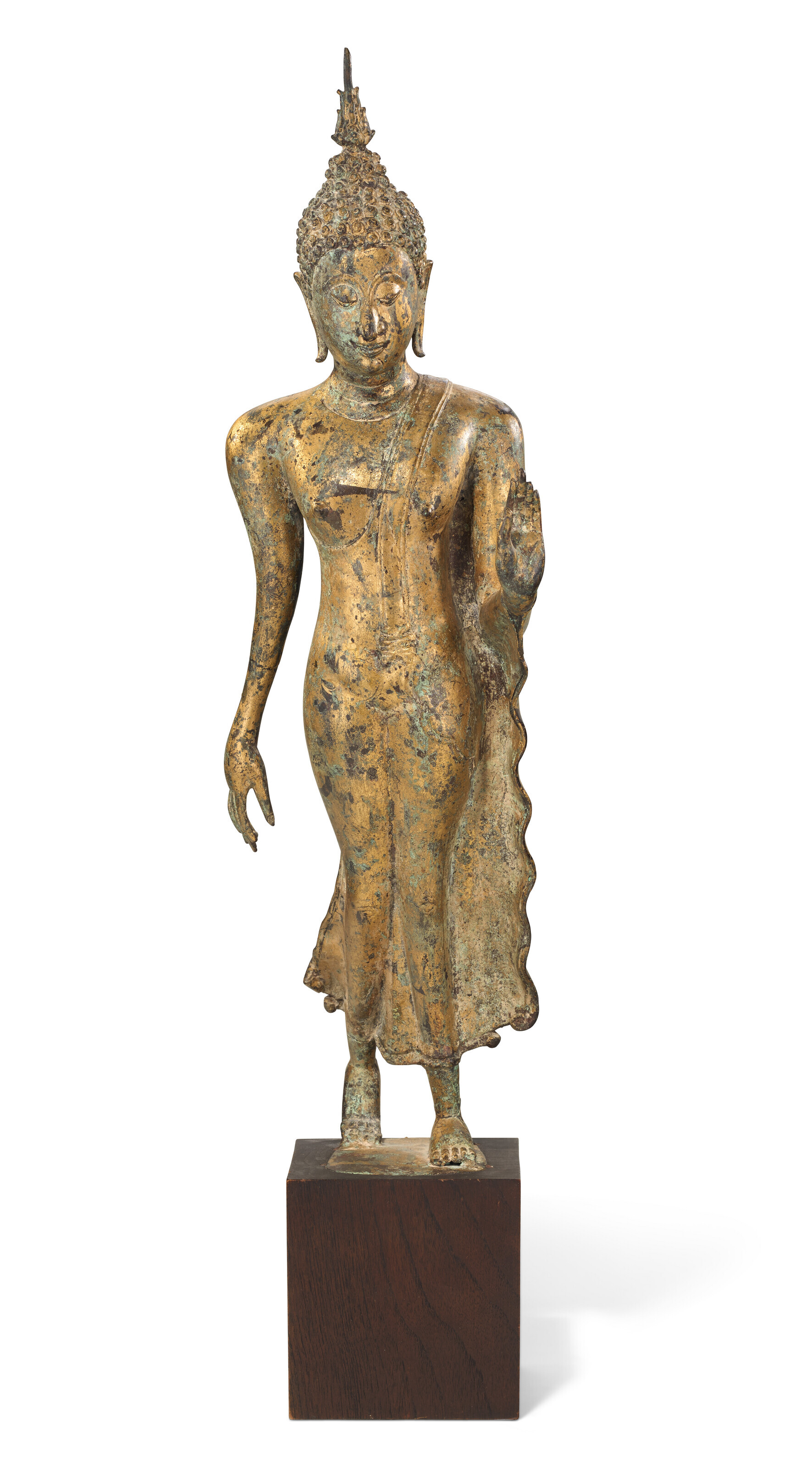 A GILT-BRONZE FIGURE OF WALKING BUDDHA, THAILAND, SUKHOTHAI STYLE