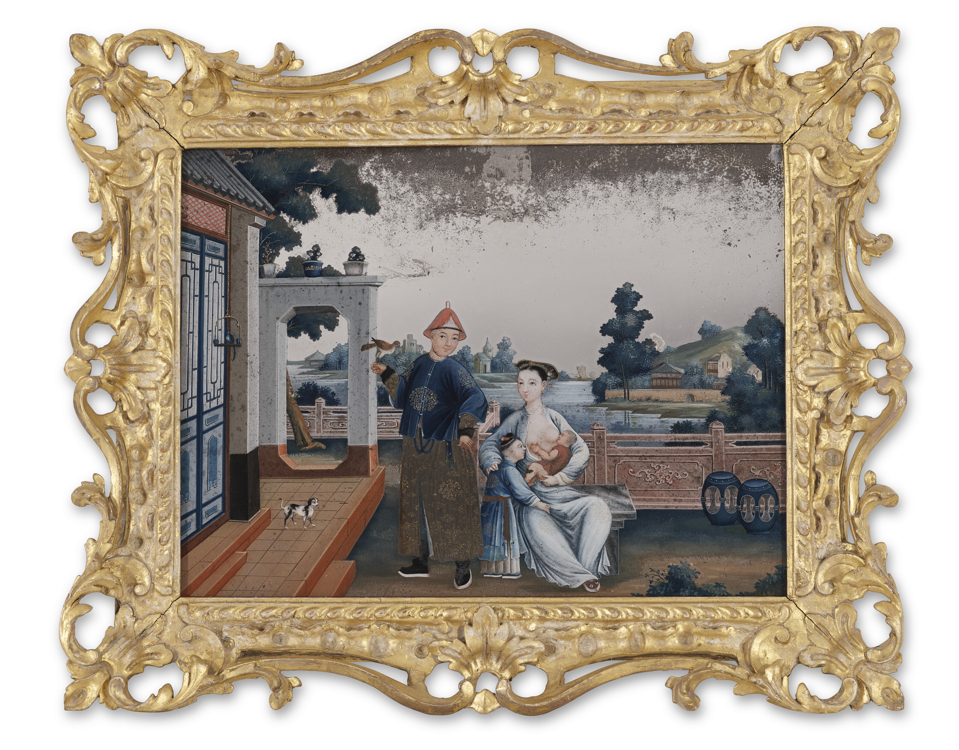 A CHINESE EXPORT REVERSE-PAINTED MIRROR IN AN EARLY GEORGE III