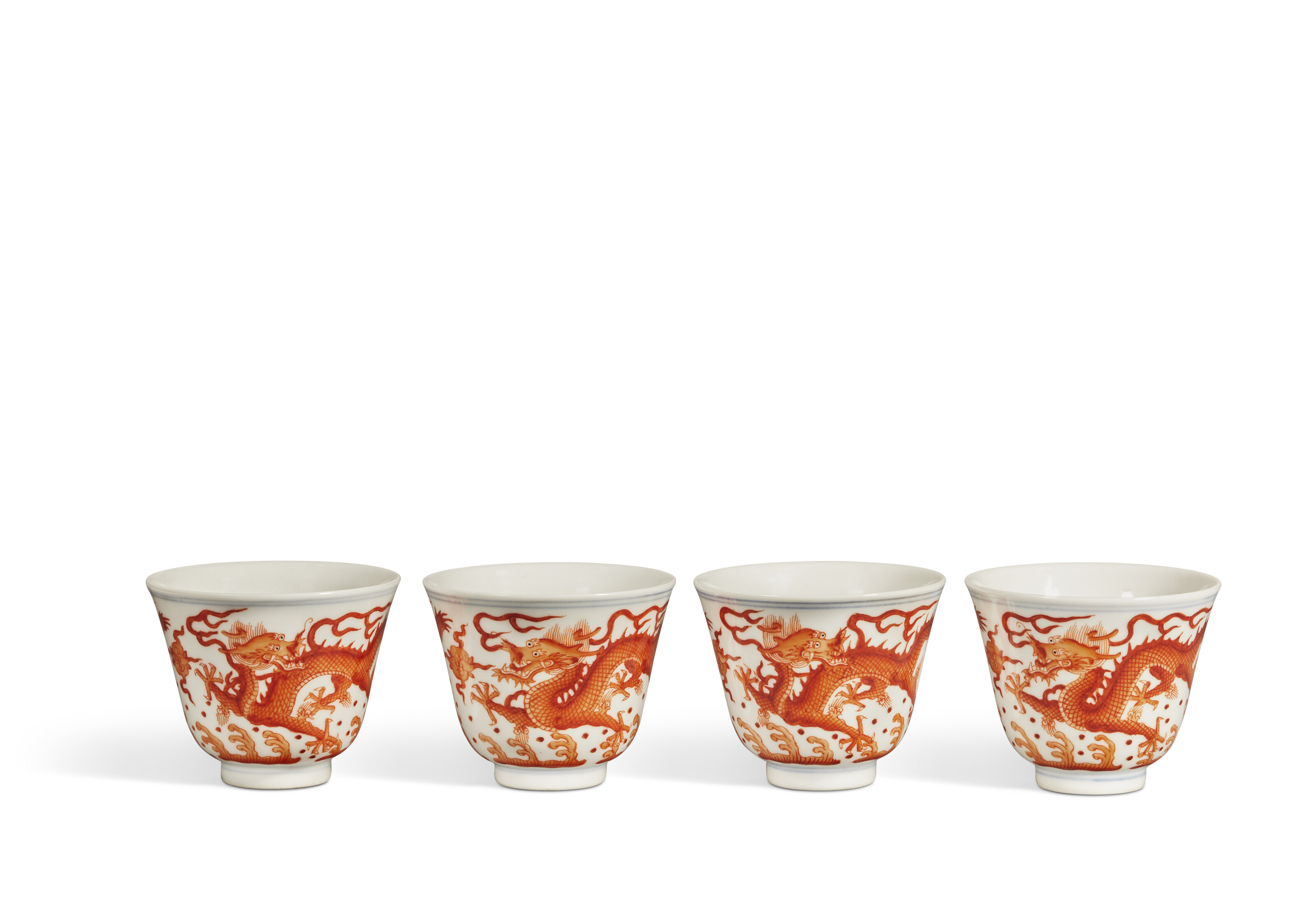 FOUR IRON-RED-DECORATED 'DRAGON' CUPS, CHINA, QING DYNASTY, TONGZHI  SIX-CHARACTER MARK IN UNDERGLAZE BLUE AND OF THE PERIOD (1862-1874) |  Christie's