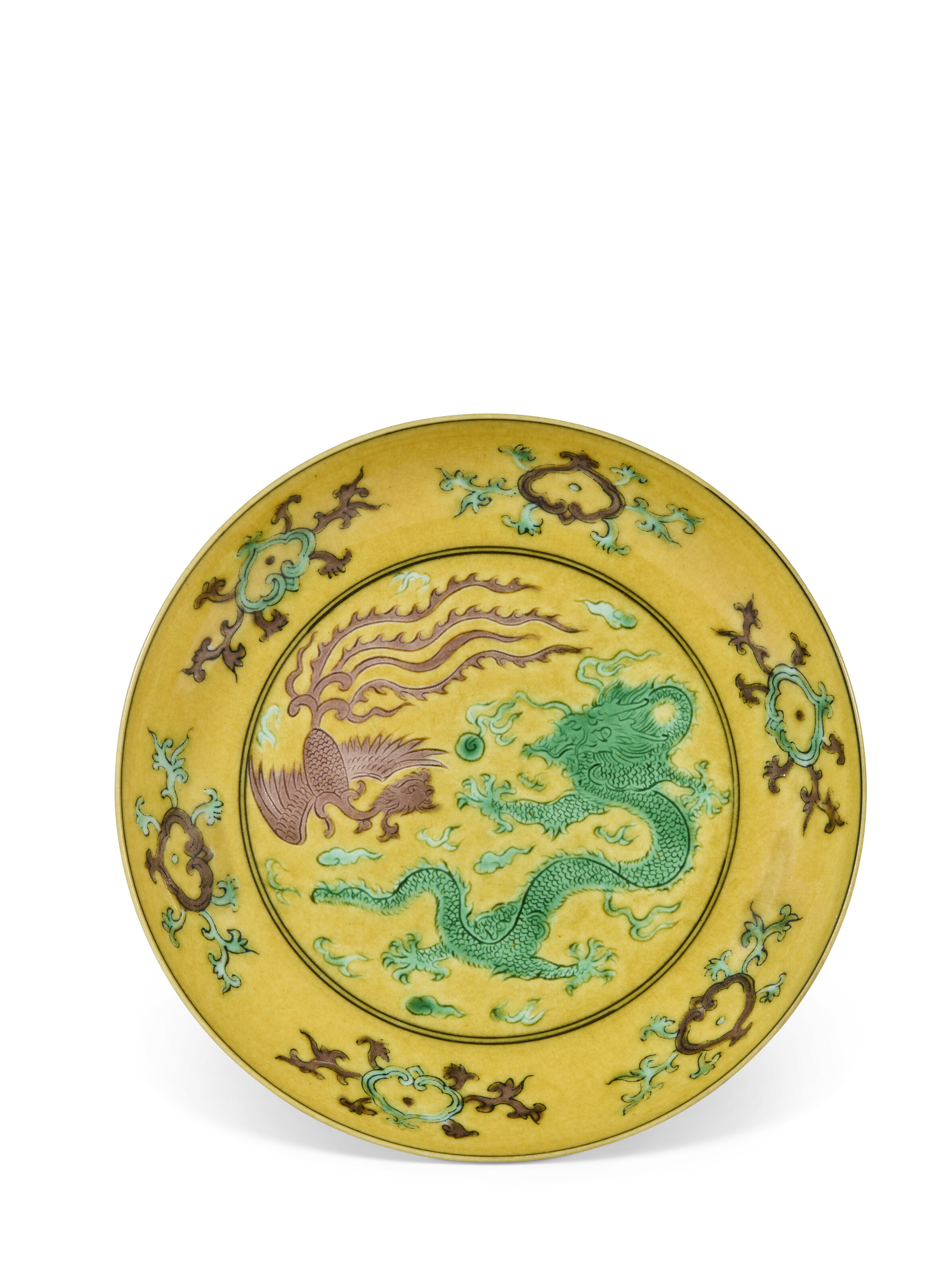 A YELLOW-GROUND GREEN AND AUBERGINE-INCISED 'DRAGON AND PHOENIX' DISH ...