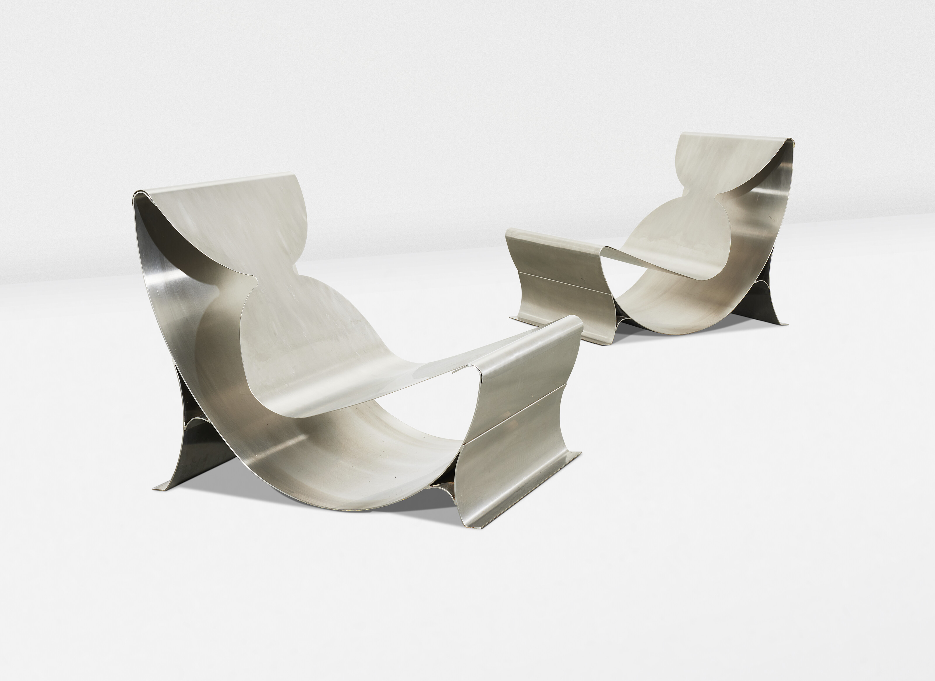 Maria Pergay, A pair of chauffeuses, circa 1970, offered in Design on 3 December 2024 at Christie's in Paris