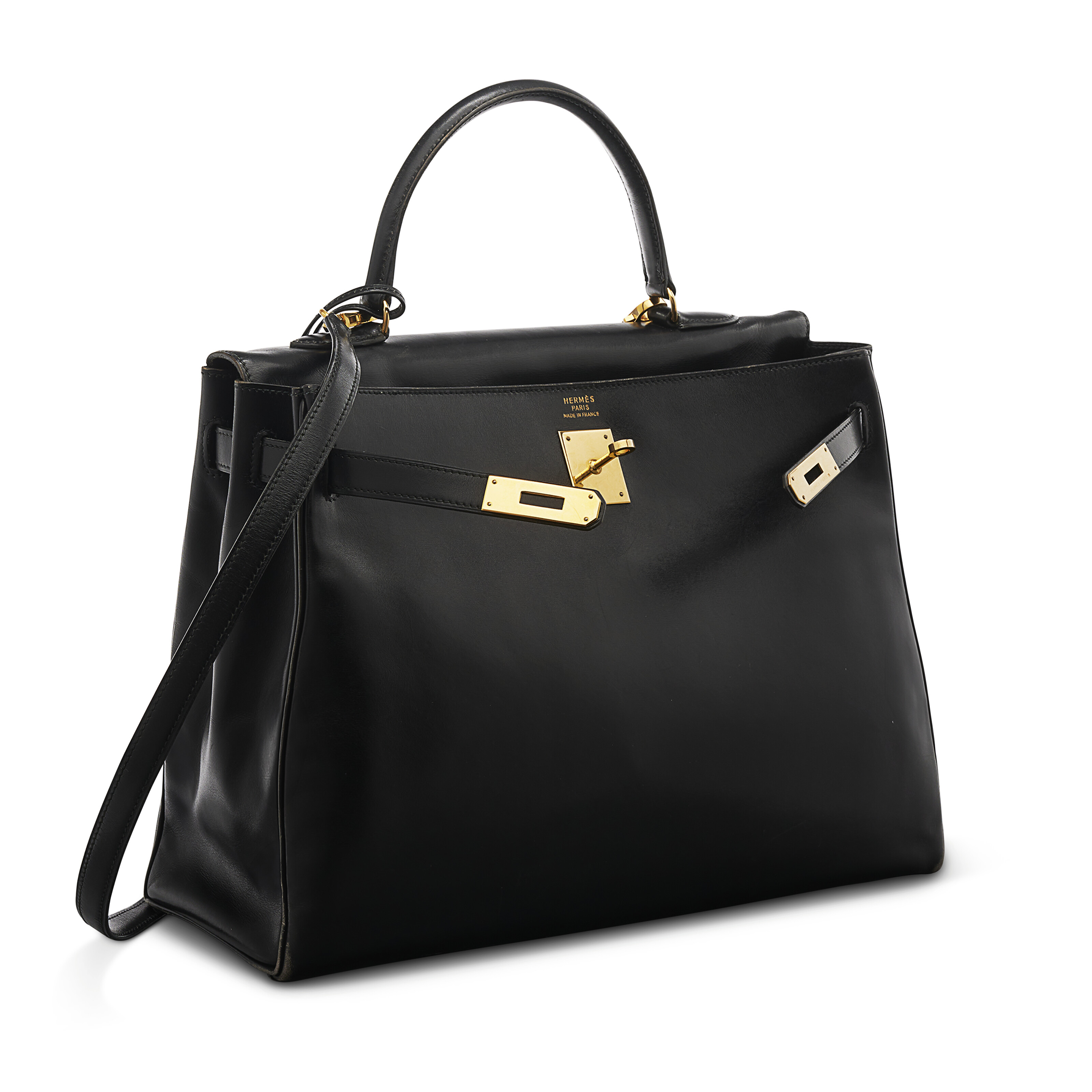 A BLACK CALF BOX LEATHER RETOURNÉ KELLY 35 WITH GOLD HARDWARE