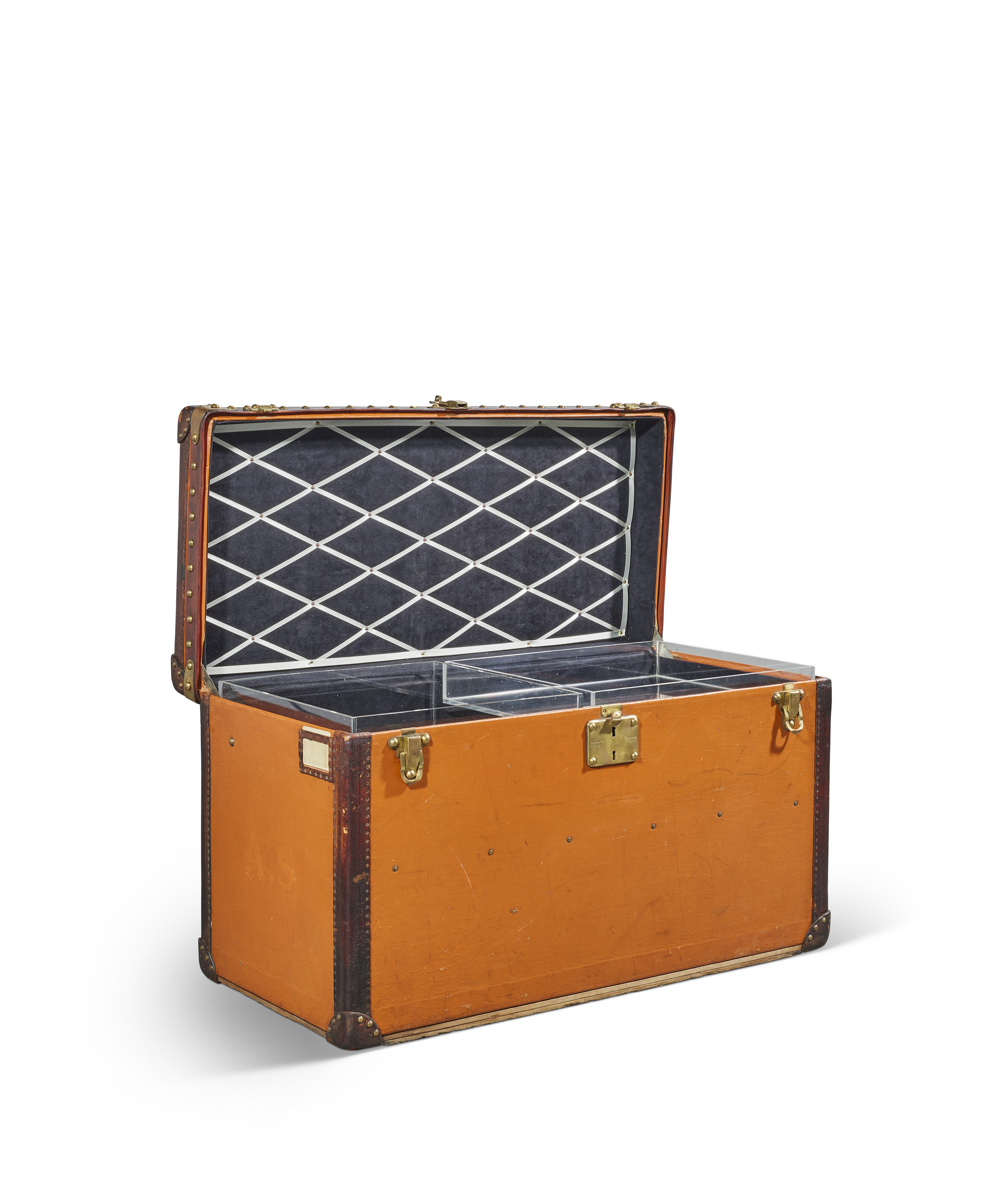 AN ORANGE VUITTONITE CANVAS STEAMER TRUNK WITH BRASS HARDWARE