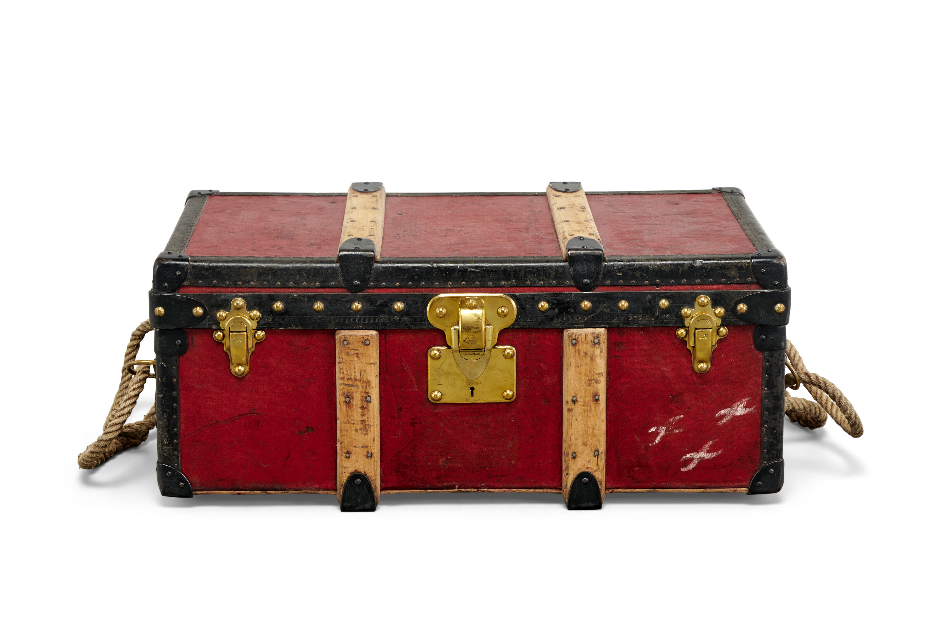 A red Vuittonite canvas trunk with brass hardware, Louis Vuitton, circa 1926, offered in Legendary trunks: A European Private Collection until 3 July 2024 at Christie's Online