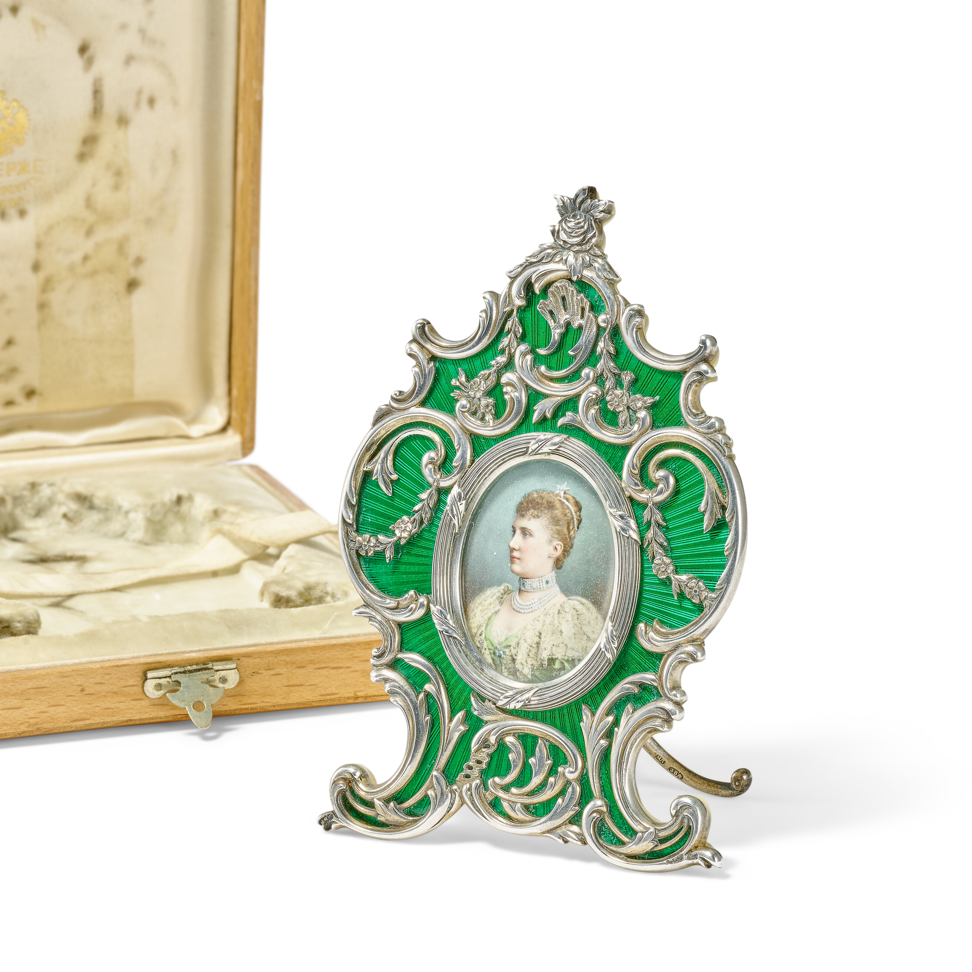 A silver-gilt and guilloche enamel photograph frame. By Faberge, workmaster Michael Perchin, St Petersburg, circa 1890, offered in The Winter Egg and Important Works by Faberge from a Princely Collection on 2 December 2025 at Christie's in London