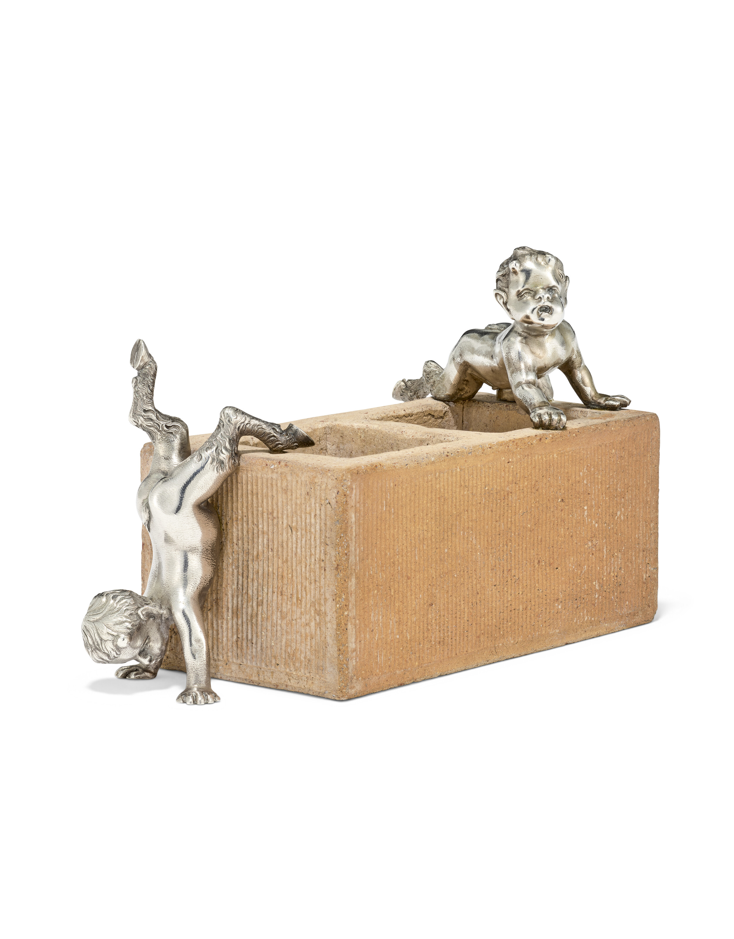 A silver-mounted clay brick match holder. By Faberge, Moscow, circa 1890, offered in The Winter Egg and Important Works by Faberge from a Princely Collection on 2 December 2025 at Christie's in London