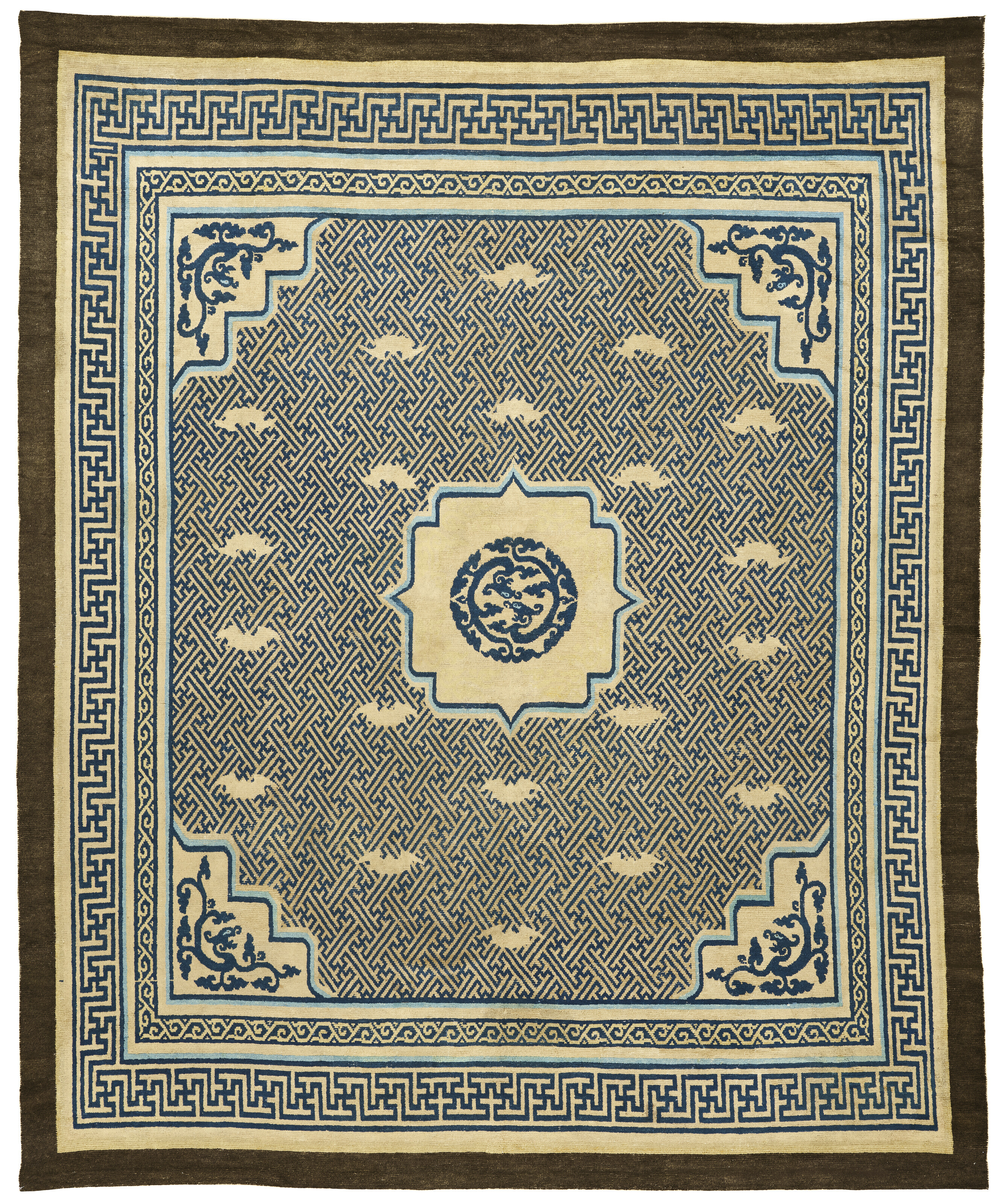 A Bat and Fret-work kang carpet, Ningxia, north China, Qing dynasty, last quarter 17th century, offered in Art of the Islamic and Indian Worlds including Rugs and Carpets on 1 May 2025 at Christie's in London