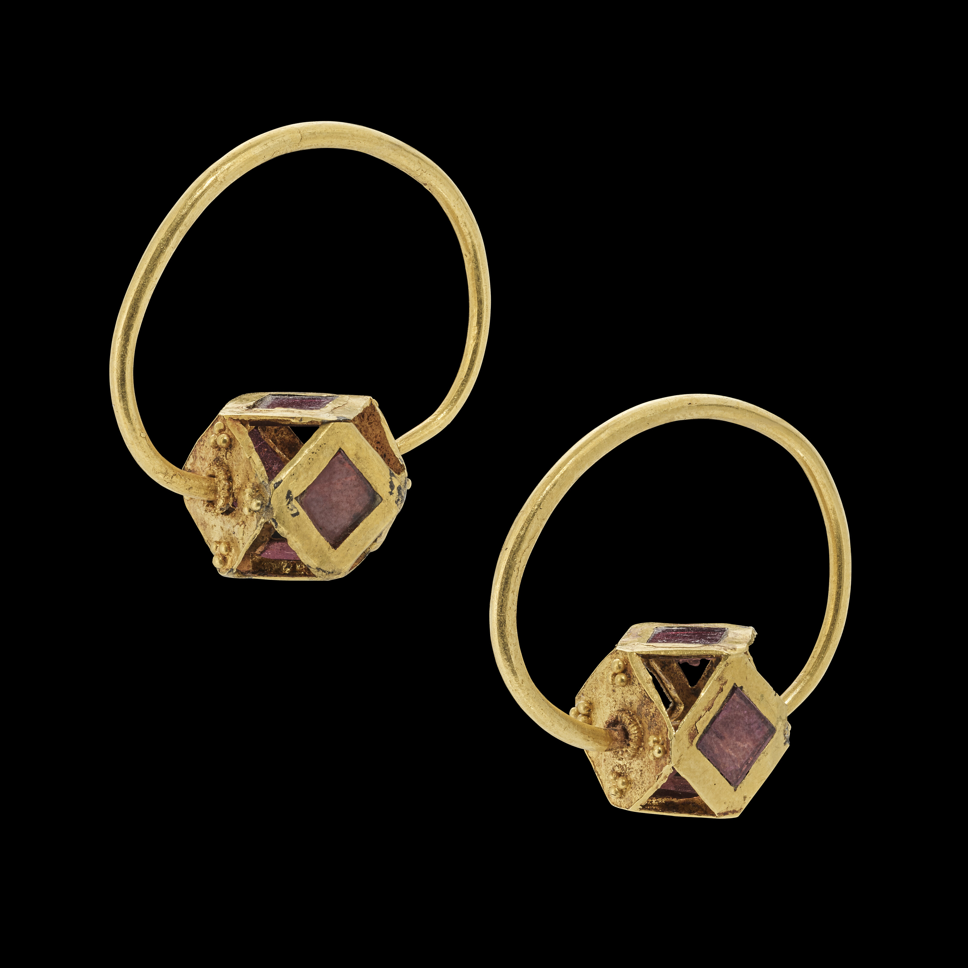 A pair of Merovingian gold and garnet earrings, circa 5th to 6th century A.D., offered in Antiquities on 2 July 2025 at Christie's in London