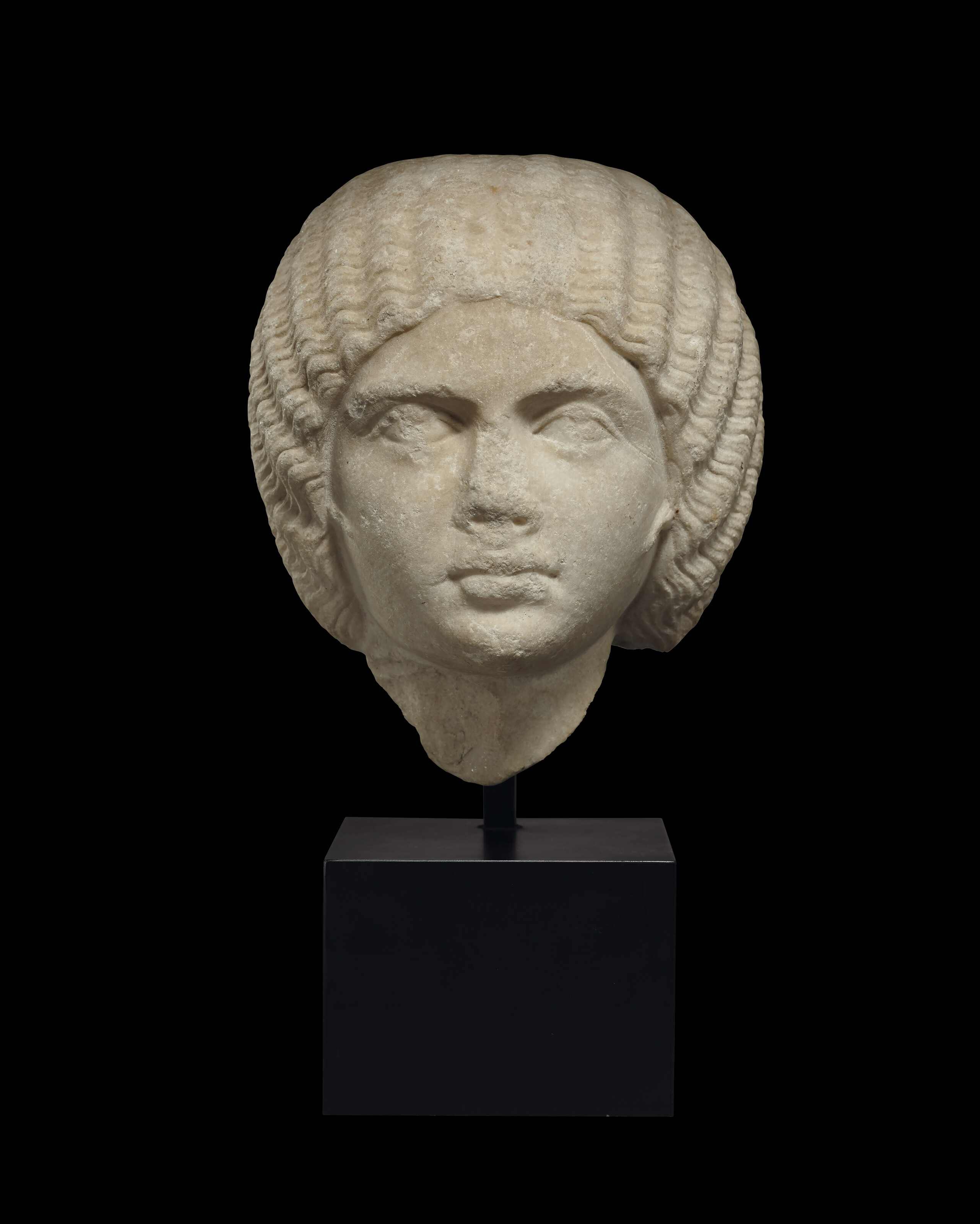 A Roman marble portrait head of a woman, Severan period, circa late 2nd century A.D., offered in Antiquities on 2 July 2025 at Christie's in London
