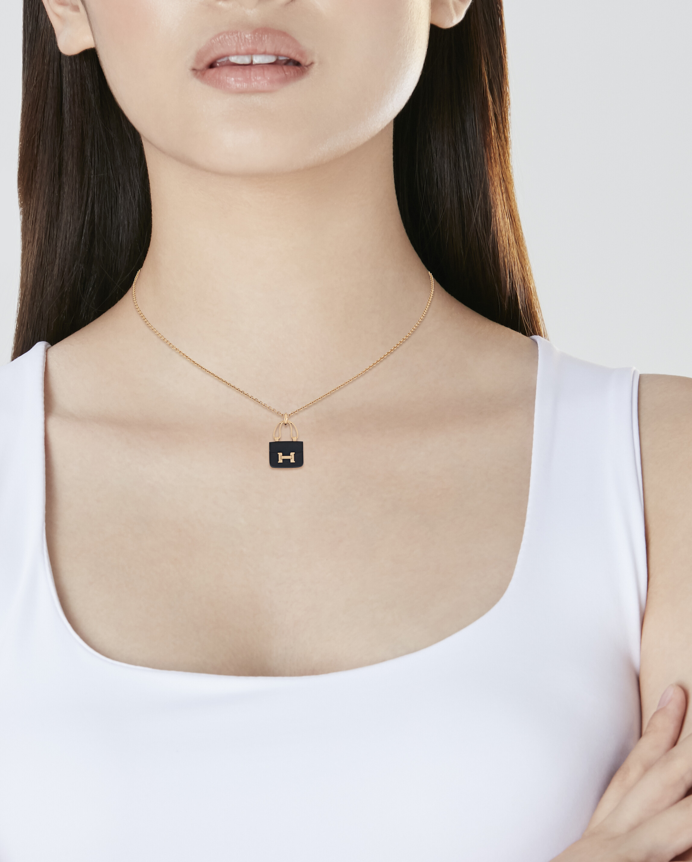 HERMÈS DIAMOND 'AMULETTES BIRKIN' NECKLACE AND BRACELET AND BLACK