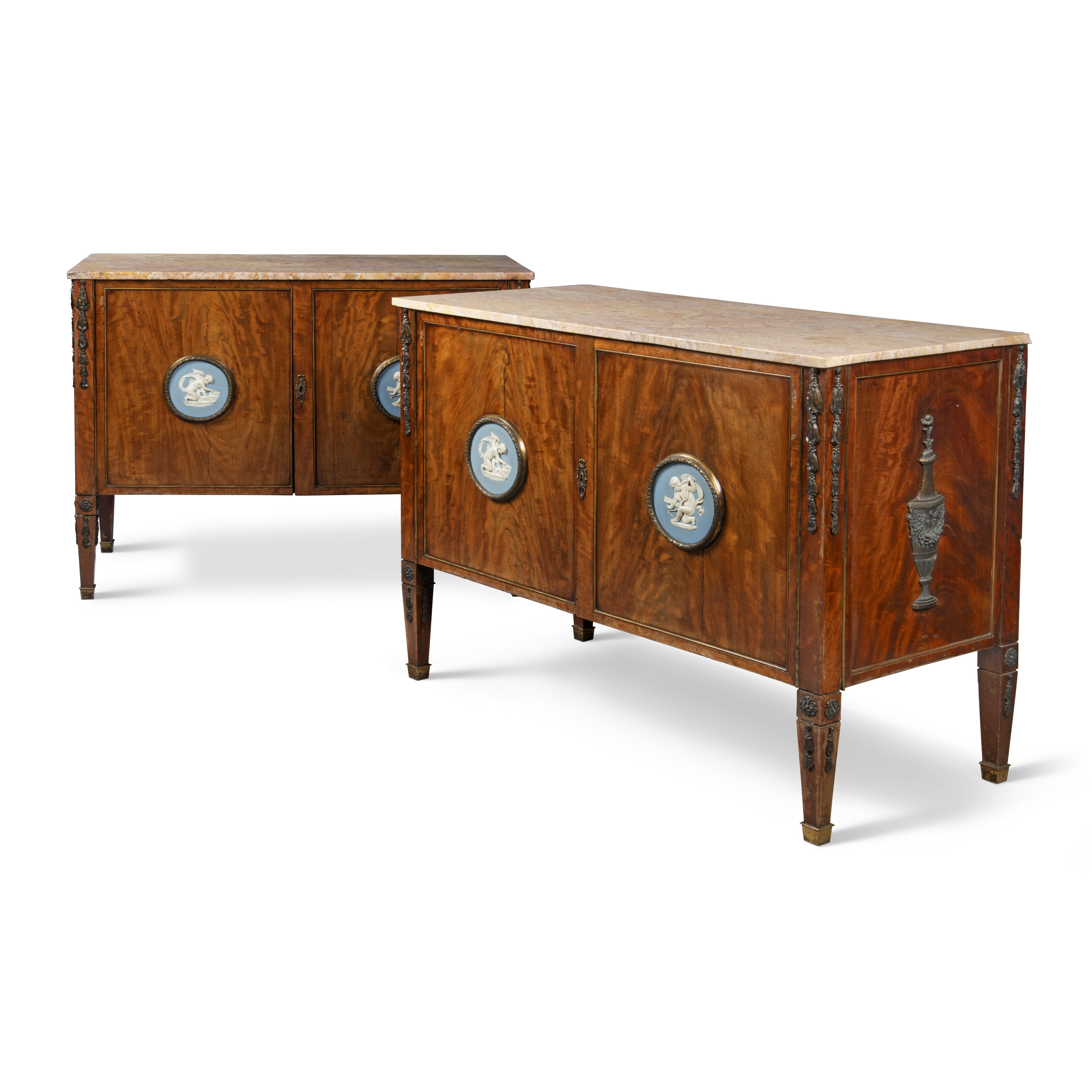A pair of German ormolu and Wedgwood Jasperware-mounted mahogany commodes, Berlin, late 18th century, later mounted in England circa 1860, offered in Collections: Property from the Viscount Wimborne and the Earl of Suffolk and Berkshire, until 9 April 2025 at Christie's Online