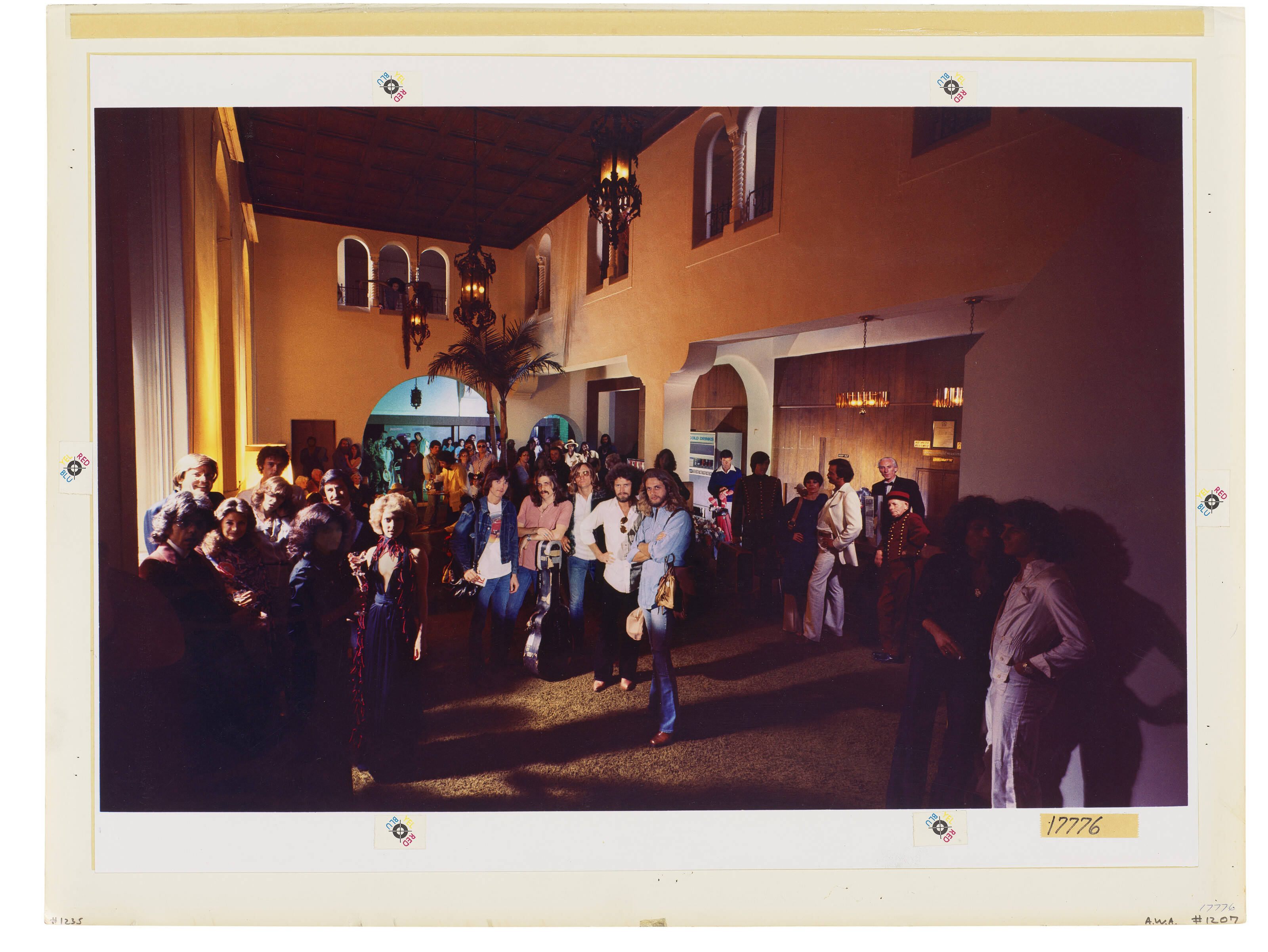 The inner gatefold of Hotel California. 'The characters standing at the counter on the right are people that I cast - they were like my repertory company, I'd used them on shoots before,' says Alexander. 'All the pretty people on the left are friends of the Eagles'