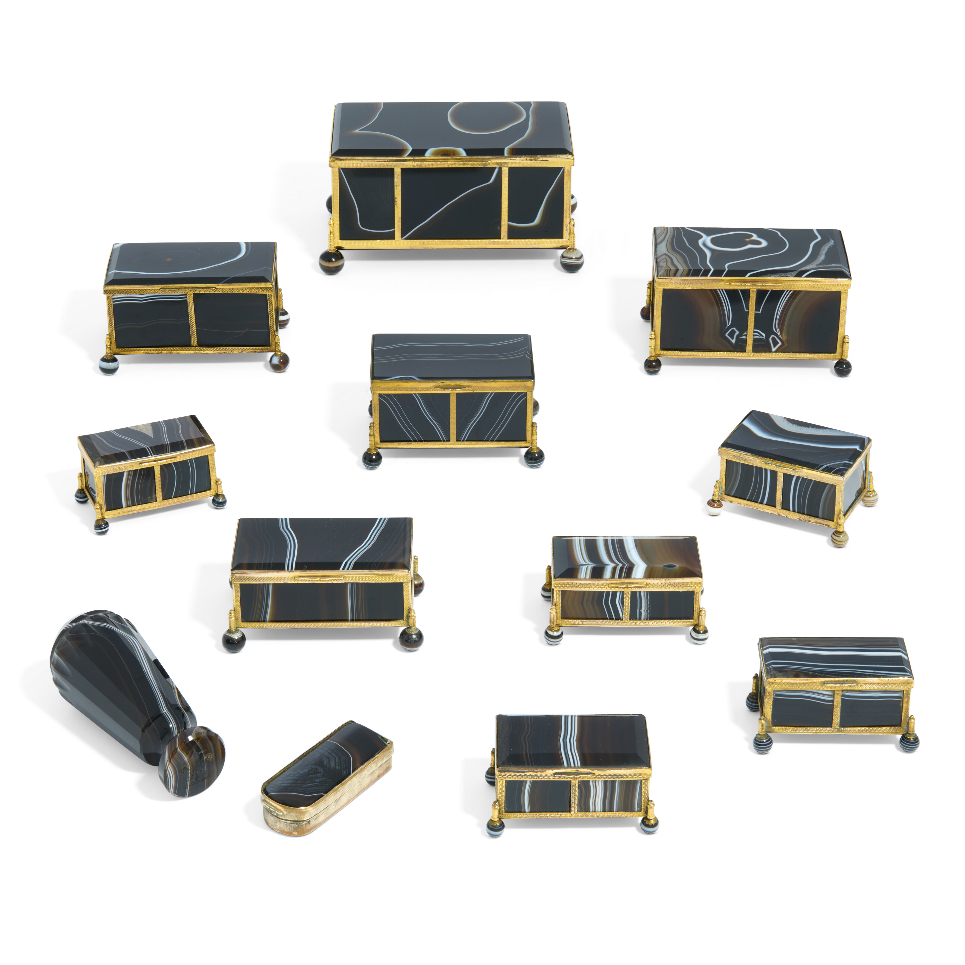 TWELVE CONTINENTAL GILT-METAL MOUNTED BLACK AGATE CASKETS AND OBJECTS ...
