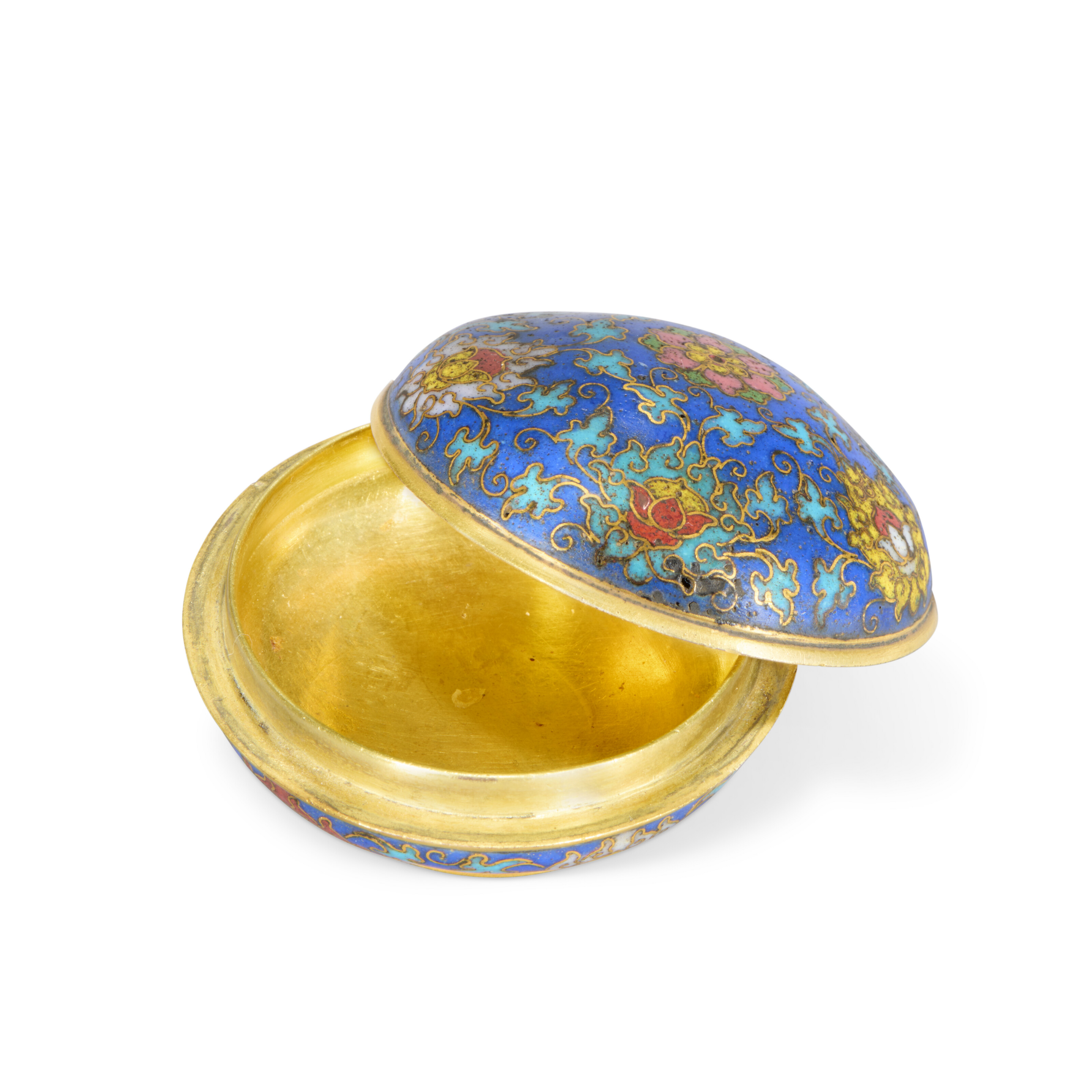 Decorated with floral motifs and bearing a Qianlong four-character incised mark on its base, this cloisonne enamel incense box would have formed part of a three-piece set comprising a tripod censer, a vase, and a box and cover