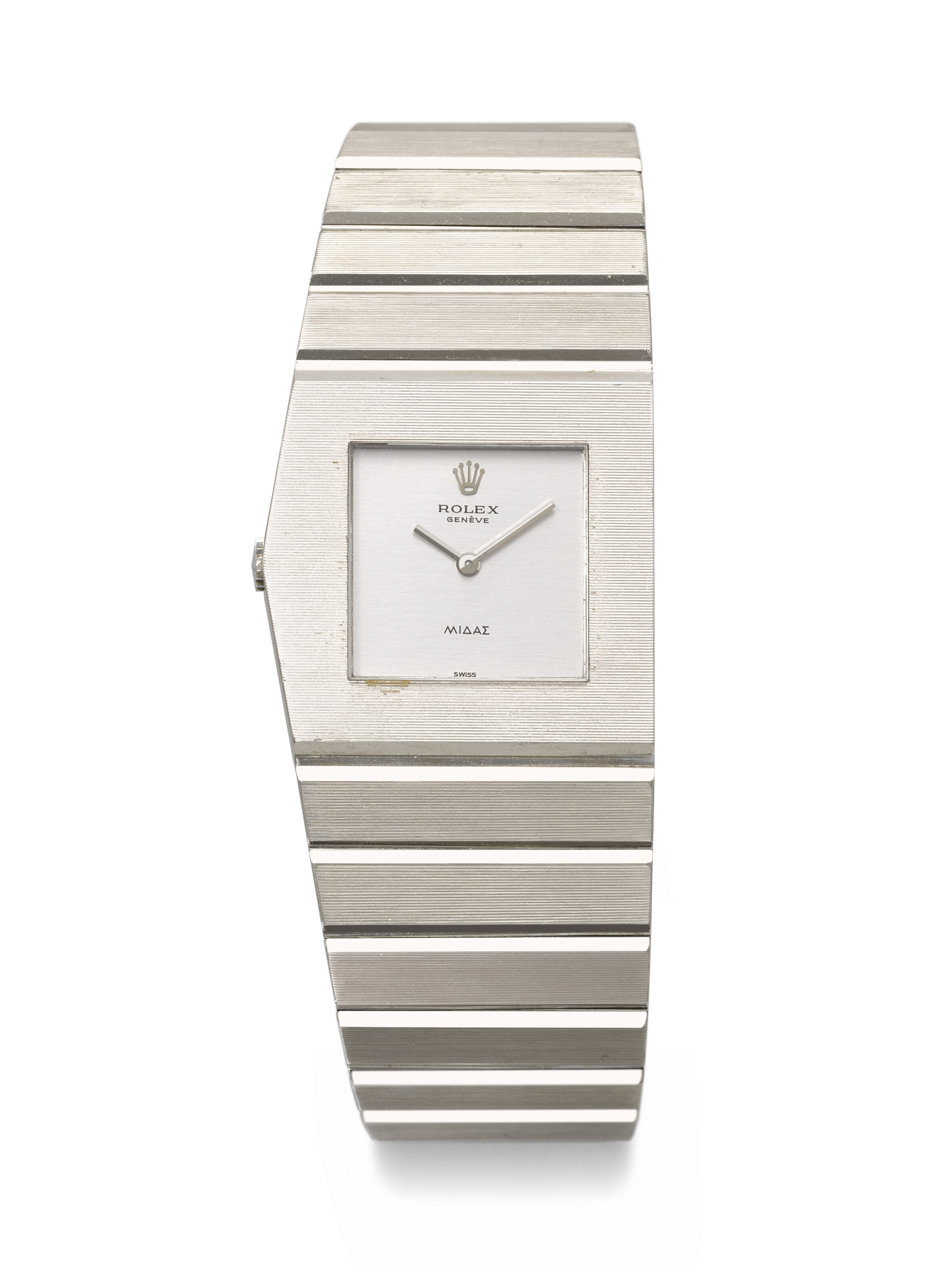 Rolex. An 18k white gold asymmetric left-handed winding wristwatch, circa 1961. King Midas model, ref. 9630, case no. 734'945, no. 102. Sold for CHF 75,600 on 12 May 2025 at Christie's in Geneva