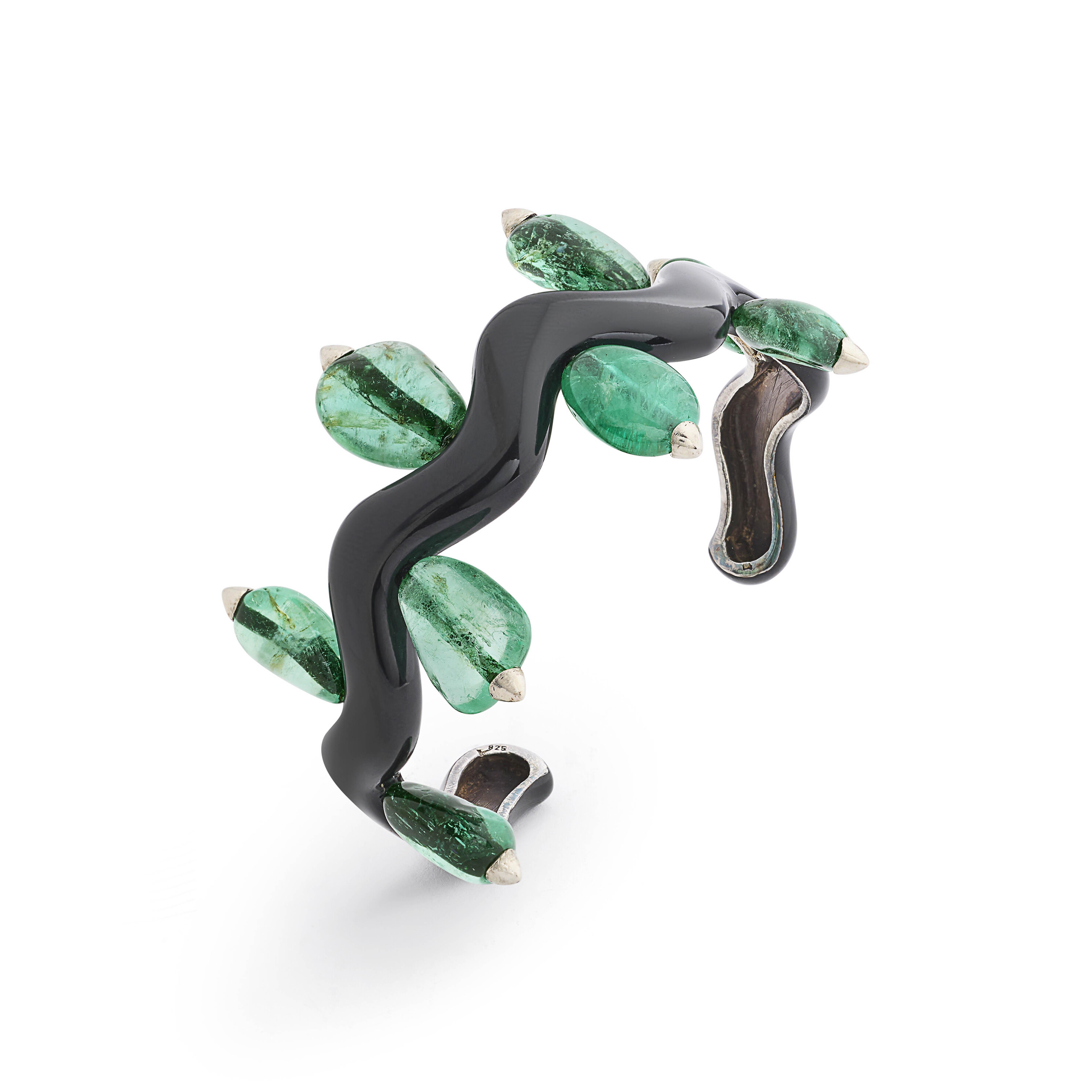 Suzanne Belperron. An emerald and enamel Vague bangle, offered in Magnificent Jewels Including A Bouquet of Gems: A Superb Collection of Jewels by JAR on 14 May 2025 at Christie's in Geneva