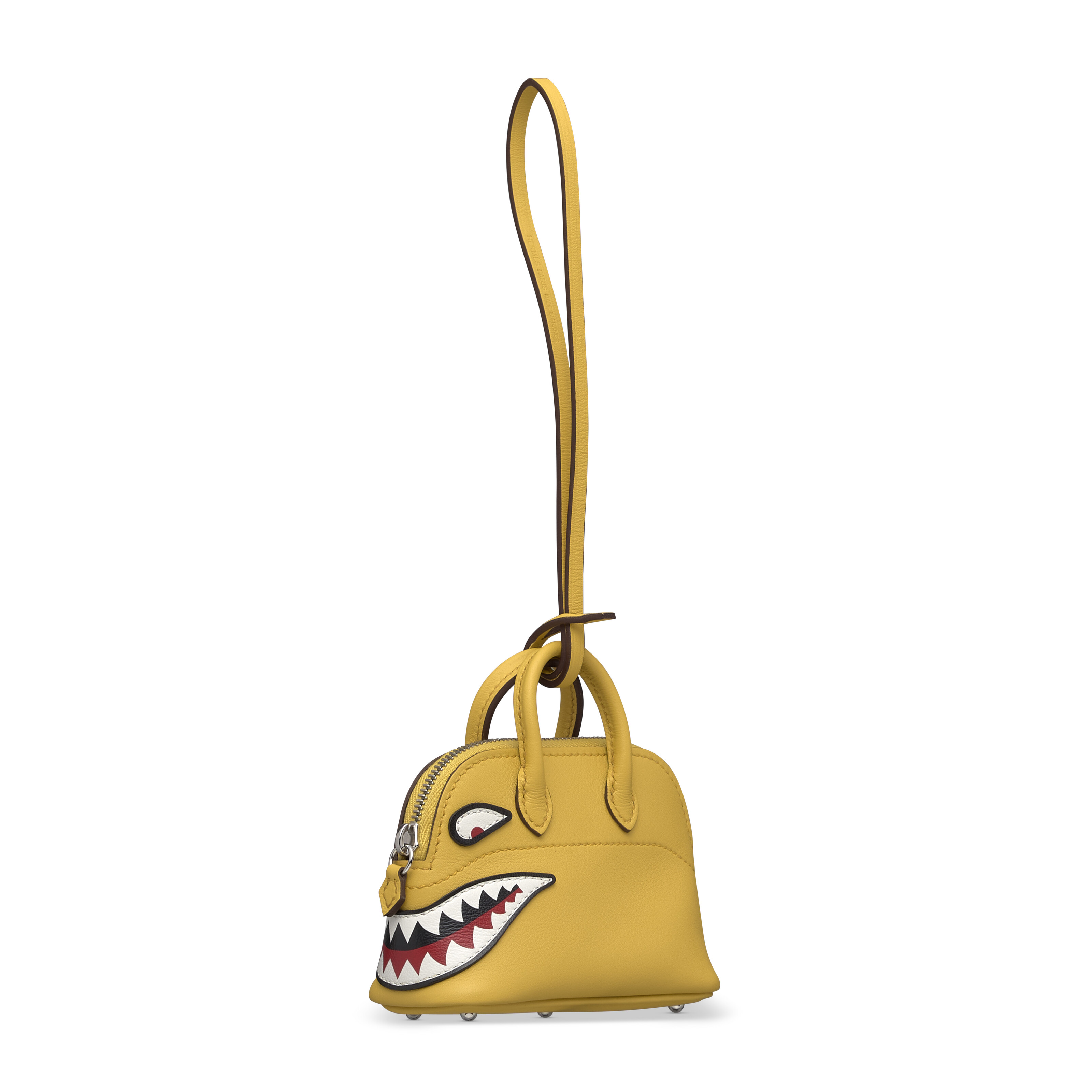 A SET OF TWO: A SUN SWIFT BOLIDE SHARK BAG CHARM WITH