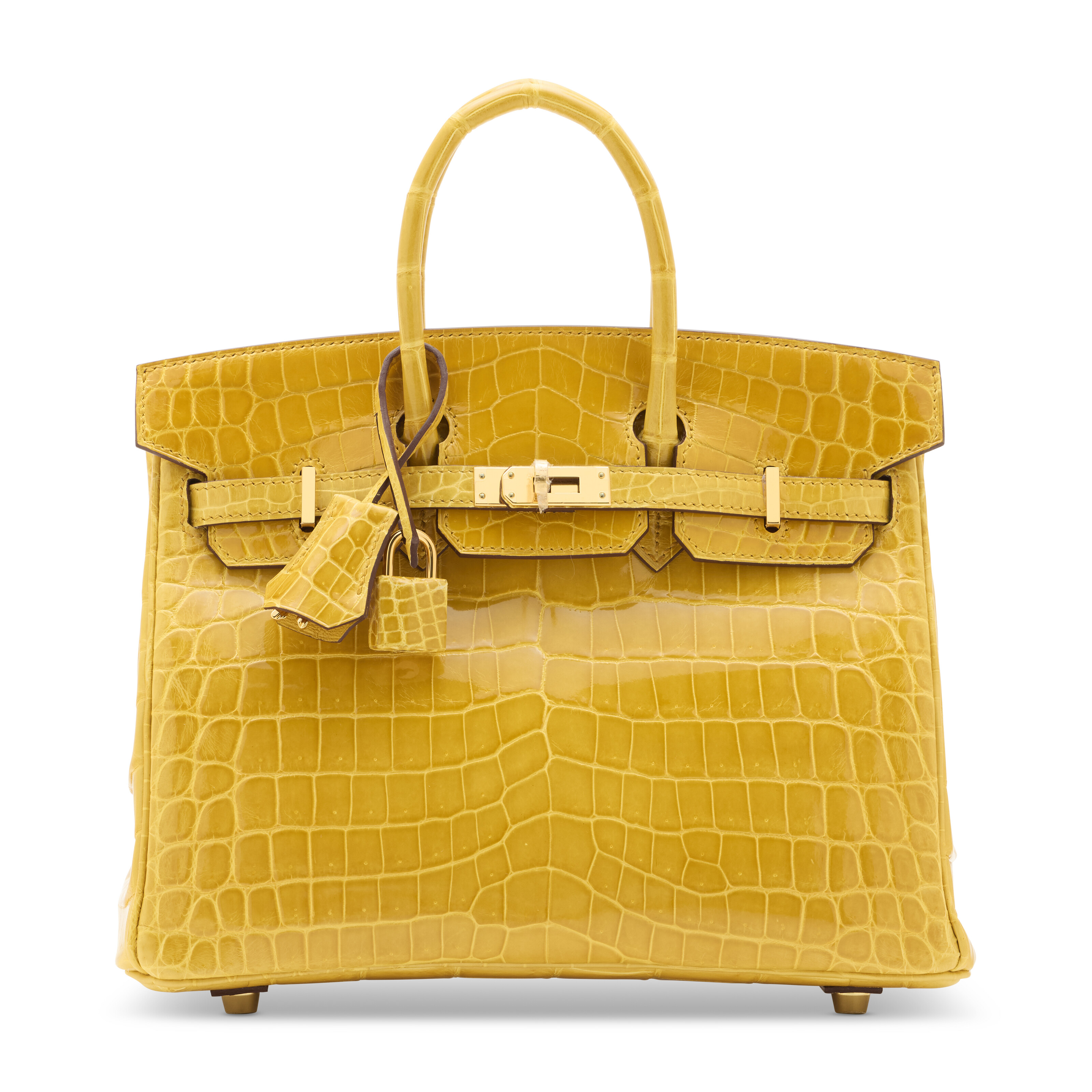 亮面琥珀黄色尼罗鳄鱼皮25公分柏金包附黄金配件，爱马仕，2019年。25 x 19 x 14 公分。估价：港元 350,000 – 450,000。此拍品将于2025年11月24日在佳士得香港典雅传承: 手袋及配饰拍卖中呈献