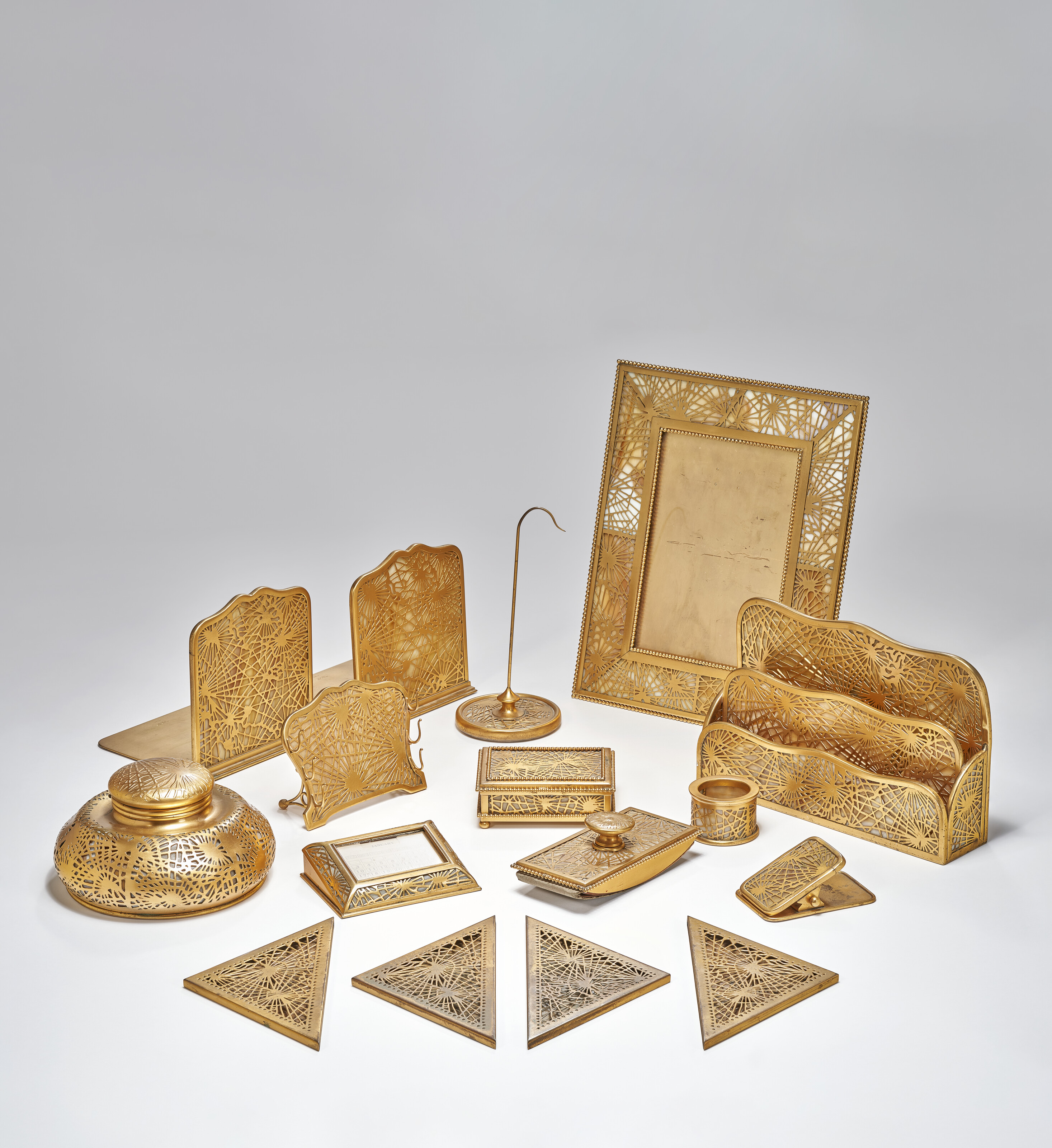 TIFFANY STUDIOS, Sixteen-Piece 'Pine Needle' Desk Set, circa 1920