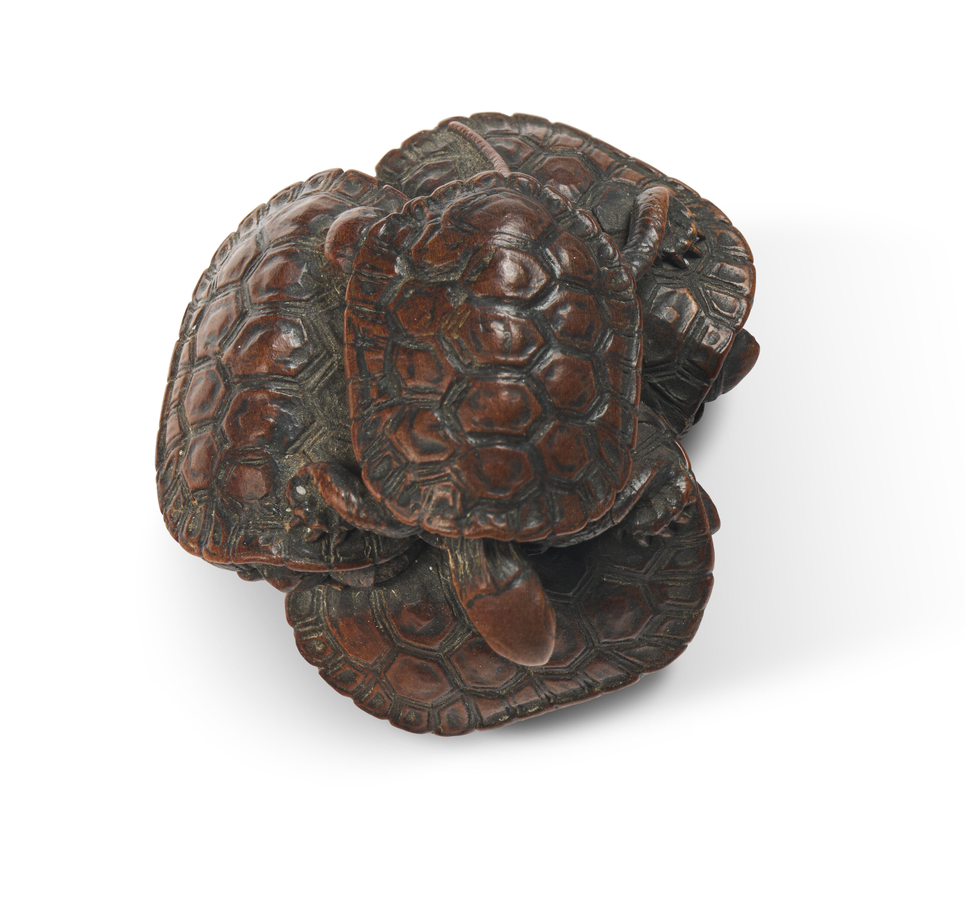 A CARVED WOOD NETSUKE OF FOUR TORTOISES, JAPAN, EDO PERIOD (19TH