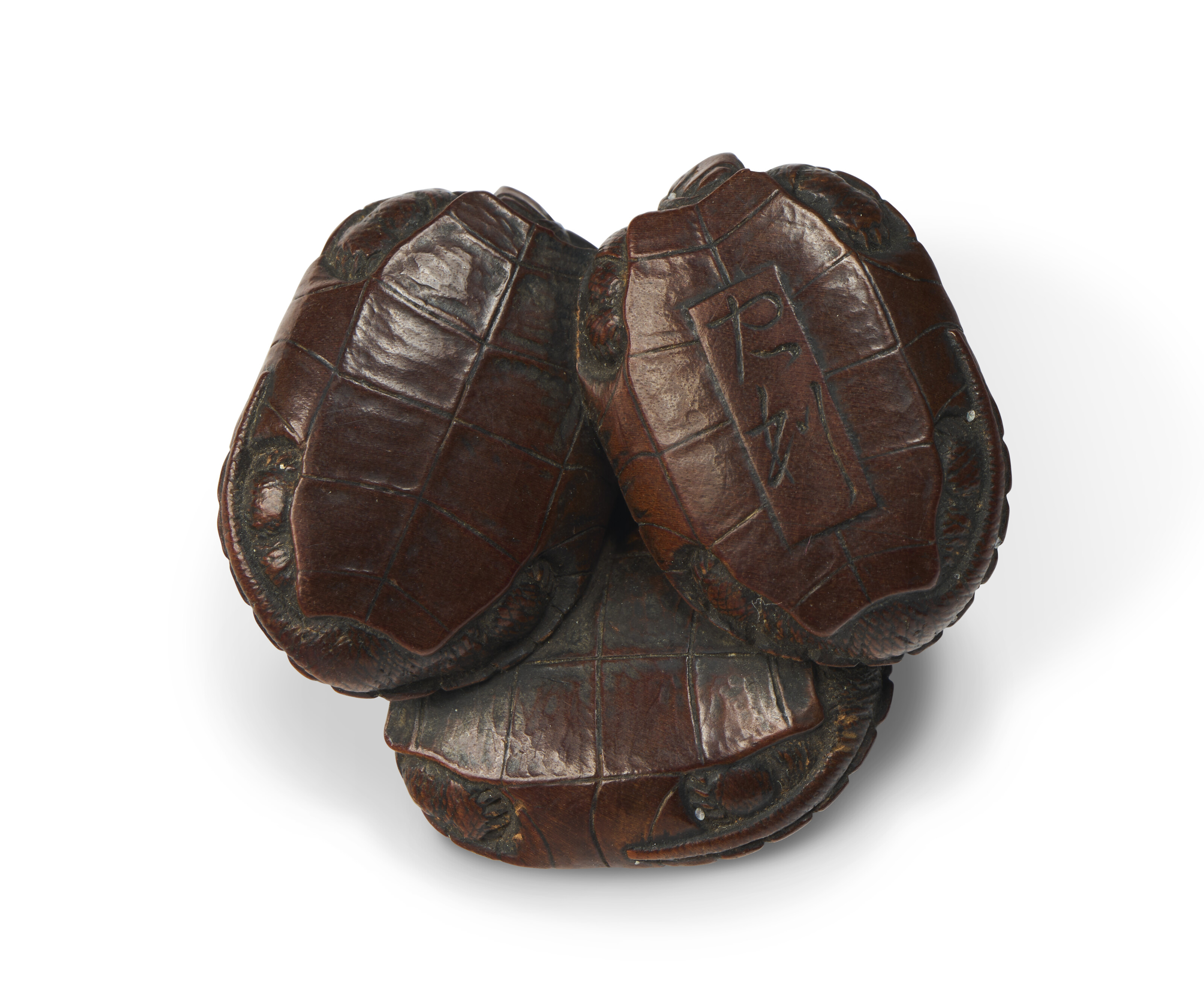 A CARVED WOOD NETSUKE OF FOUR TORTOISES, JAPAN, EDO PERIOD (19TH