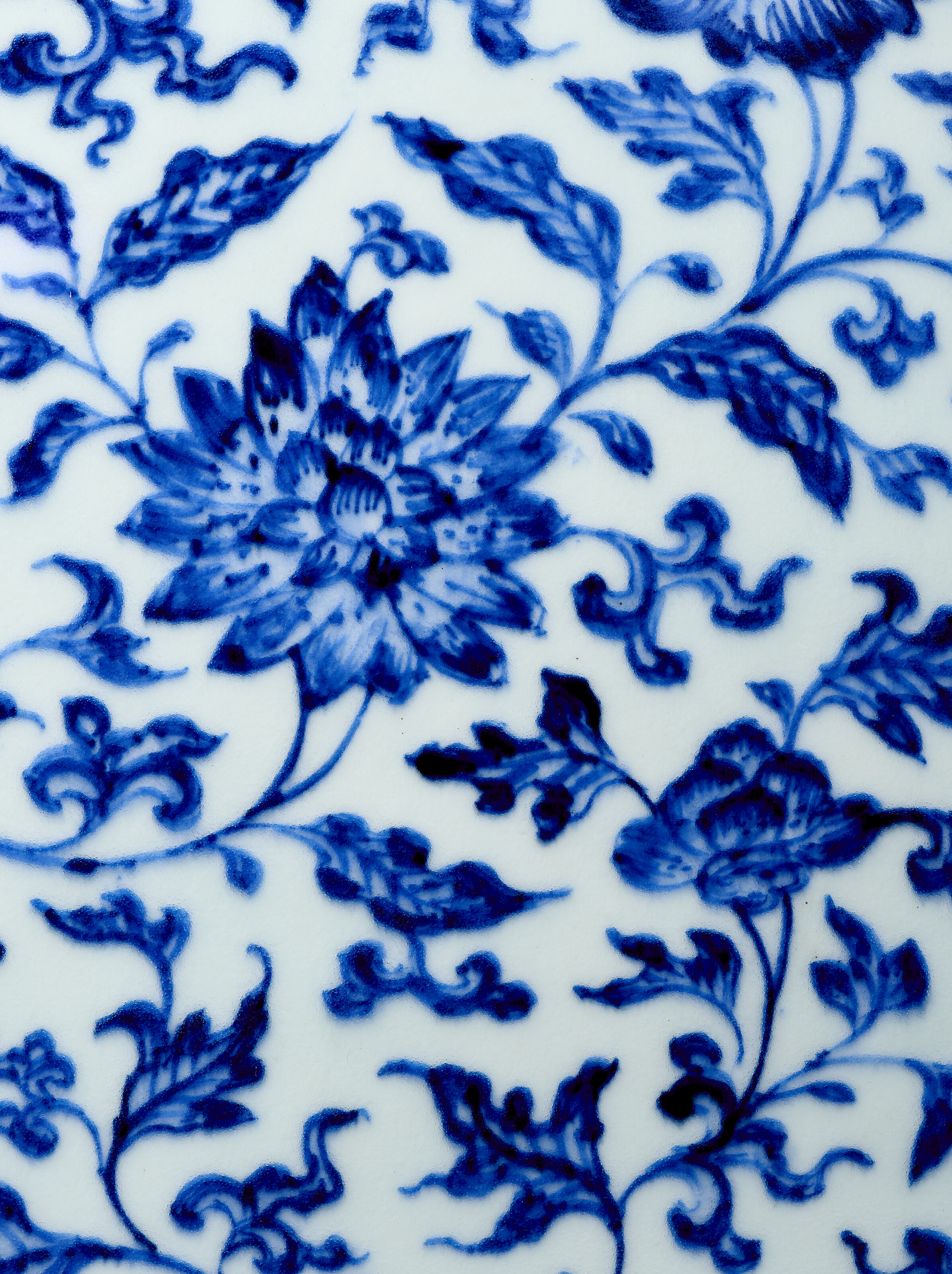 A VERY RARE BLUE AND WHITE 'FLORAL SCROLL' MOON FLASK