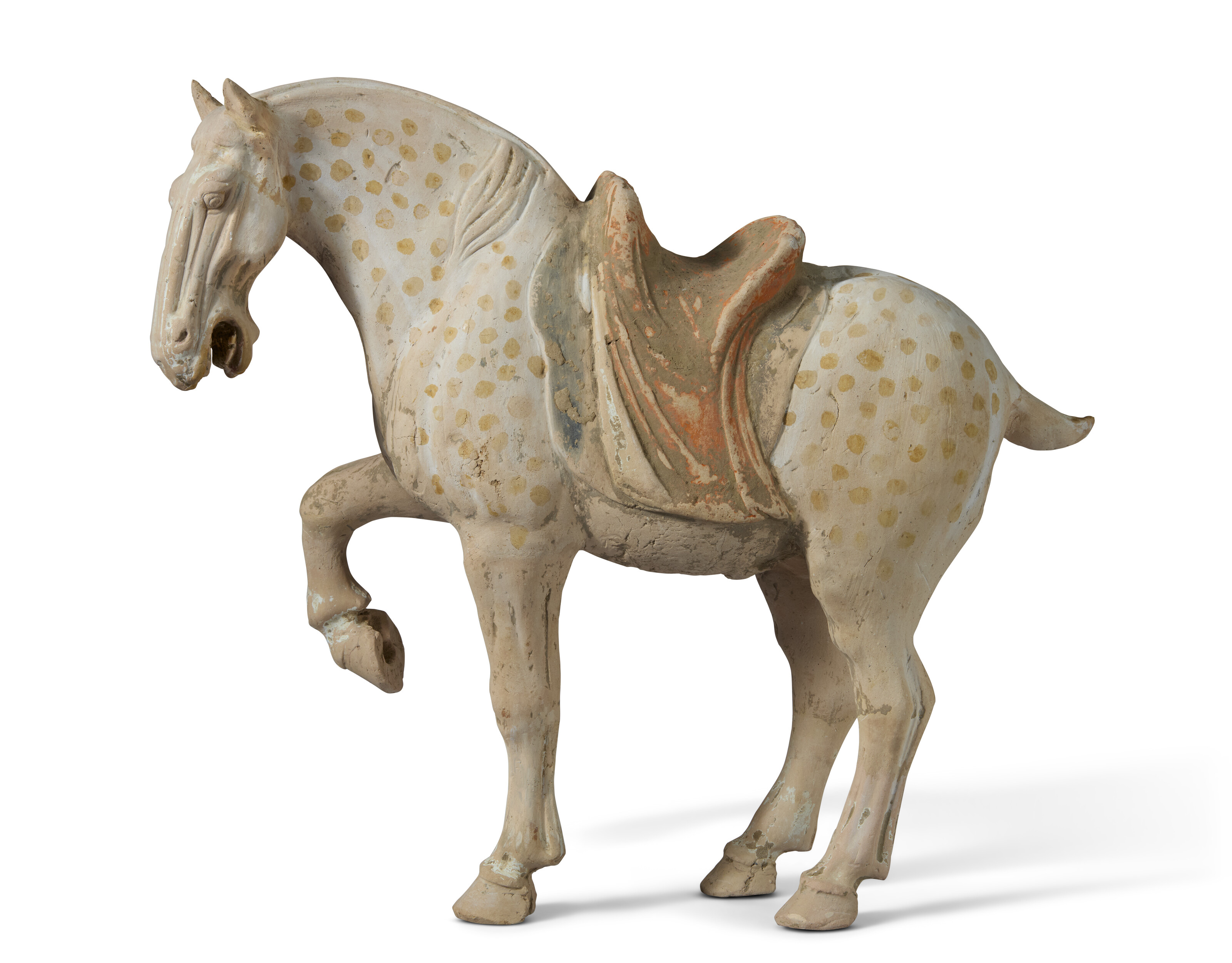 A PAINTED POTTERY FIGURE OF A PRANCING PIEBALD HORSE, CHINA, TANG ...