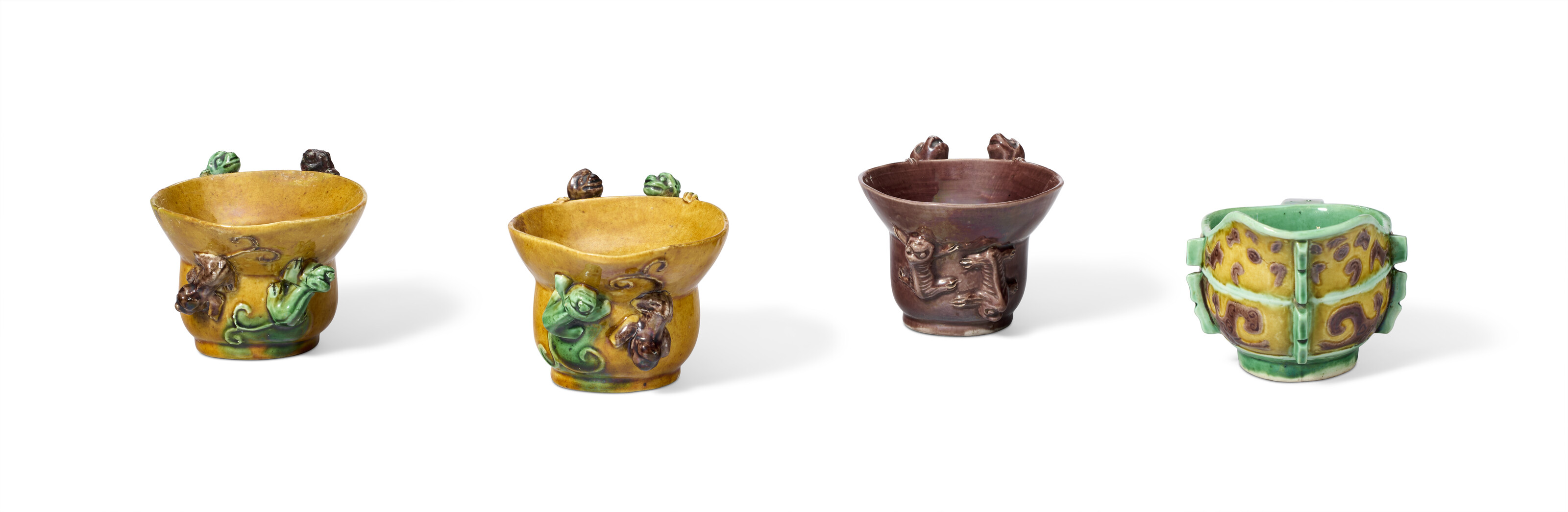 THREE GREEN, YELLOW AND AUBERGINE-GLAZED LIBATION CUPS, CHINA